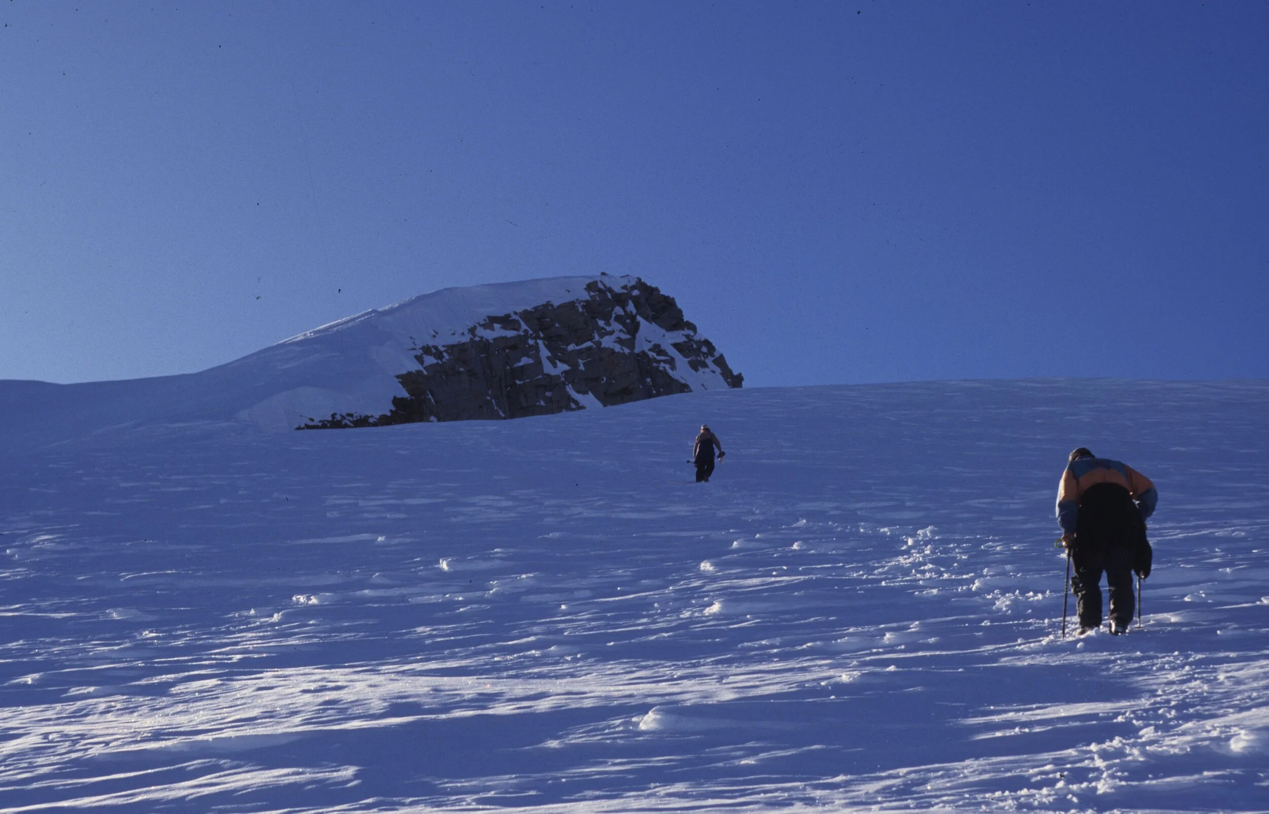 Glen Plake, Darren Johnson climb toward basin below Mount Humphries