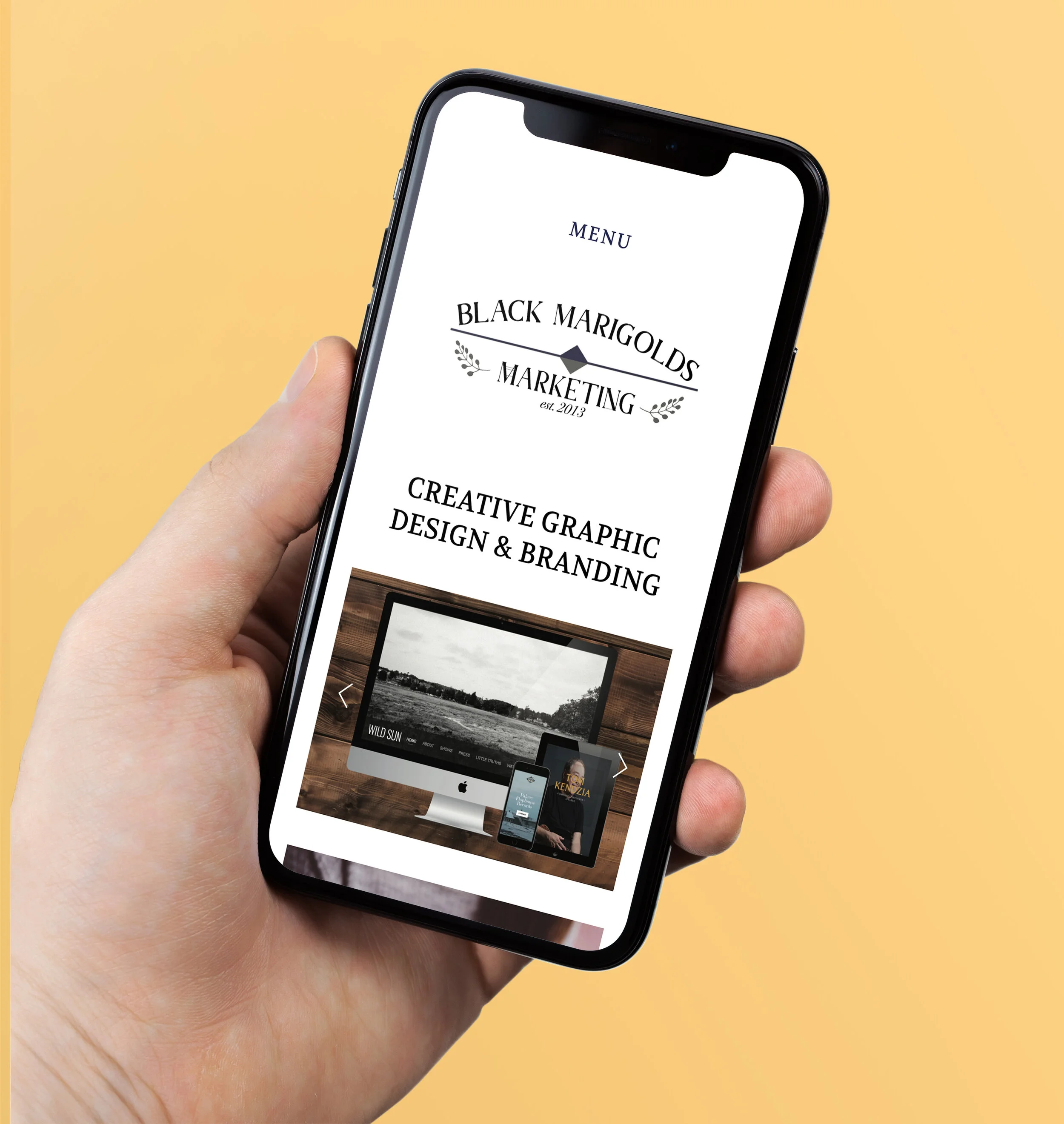 BMM.Iphone X in Hand Mockup.jpg