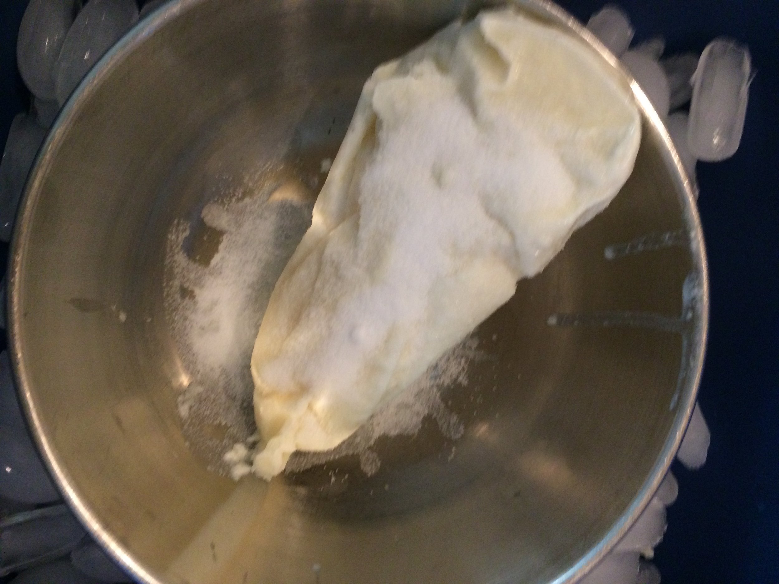 I sprinkle the lye on the milk and start scraping off the melting milk, constantly stirring. keep adding lye. 