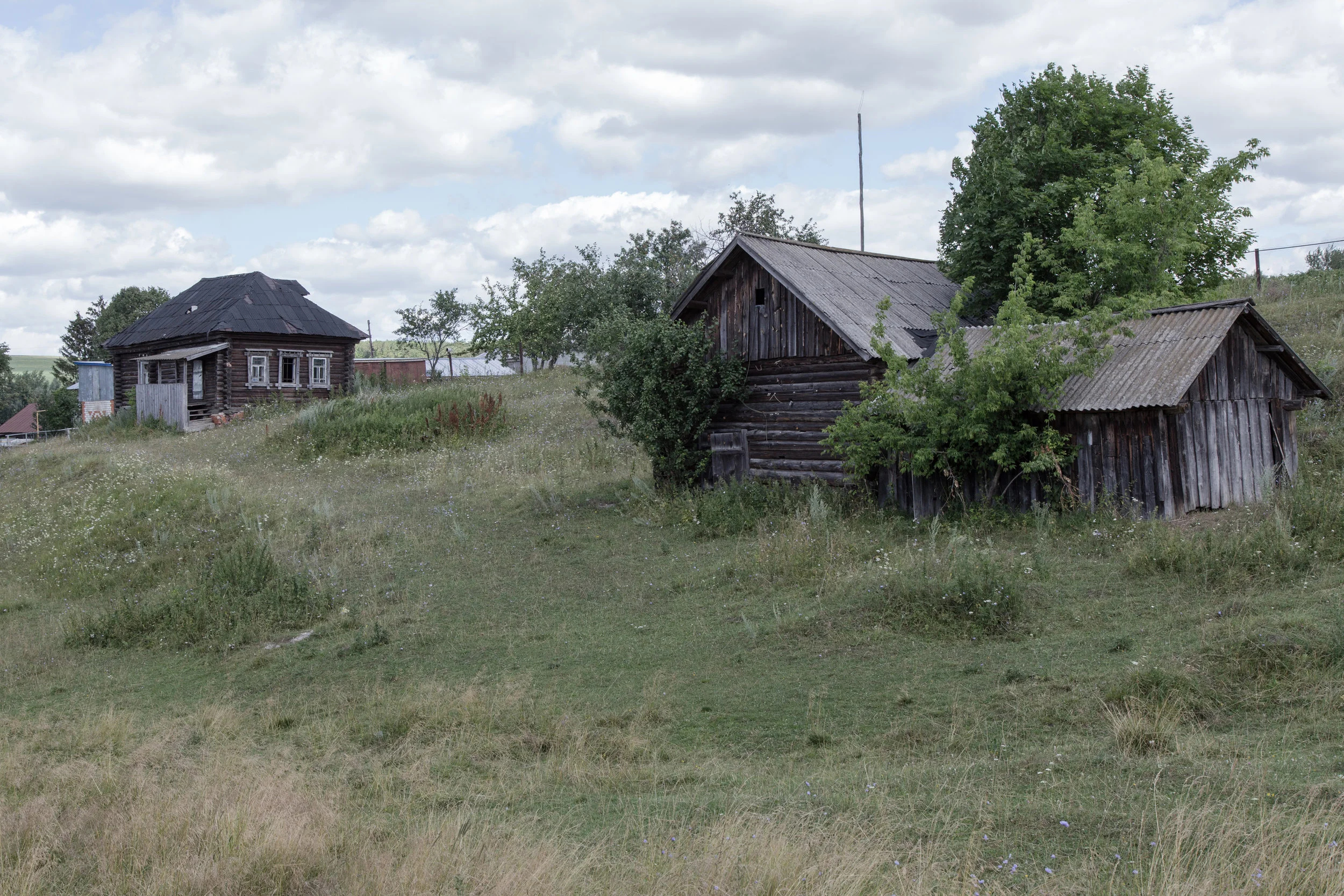 An old clubhouse (the building in the back) and a granary (building in the foreground).
