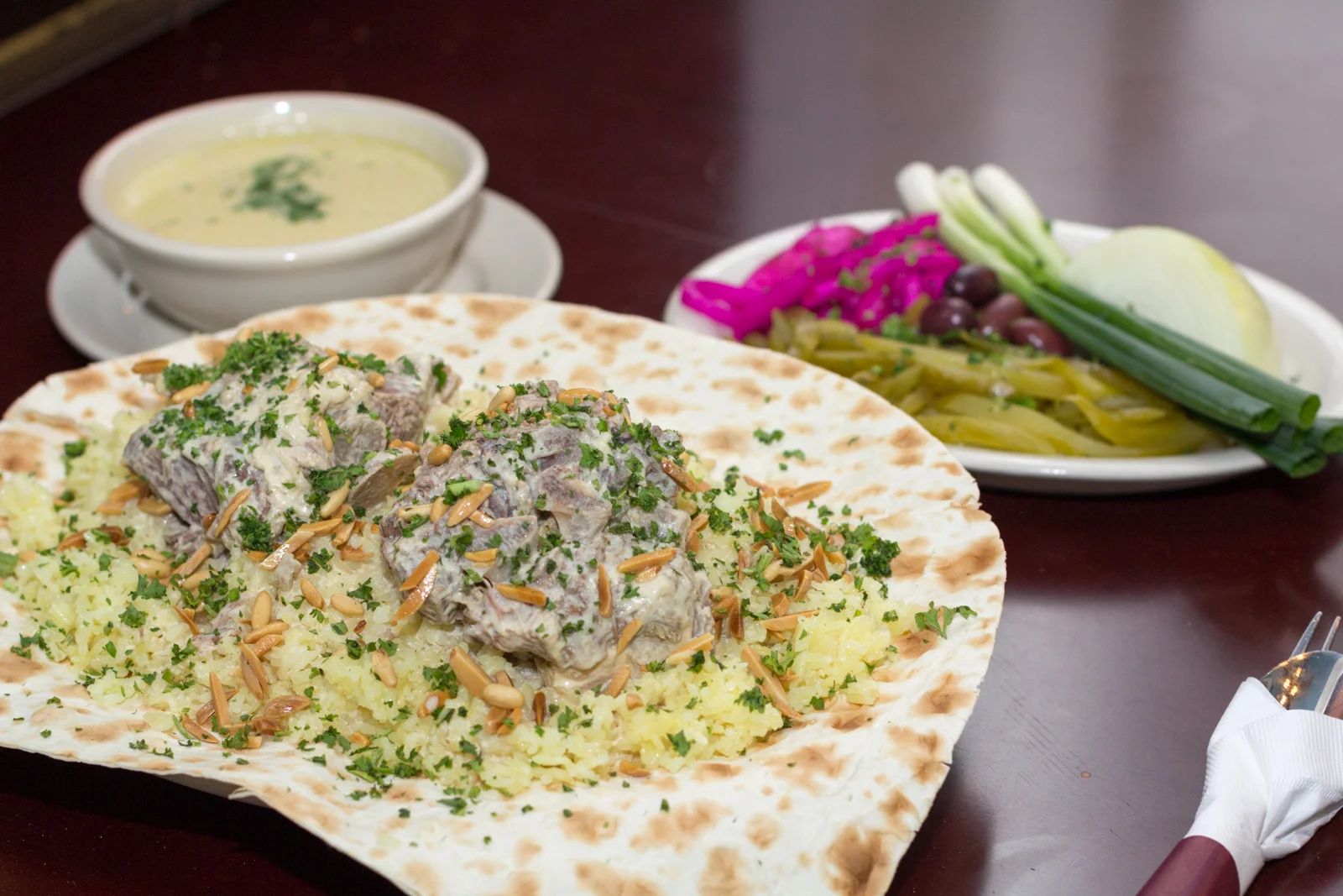 Traditional Jordanian mansaf. Photo taken by Evan Carroll, distributed under CC BY-SA 4.0 license.