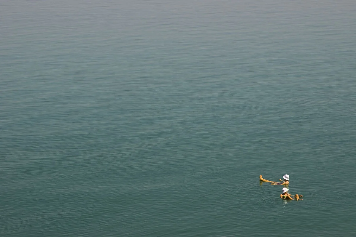 Floating in the Dead Sea. Photo taken by Audrey Sel, distributed under CC BY-SA 2.0 license.