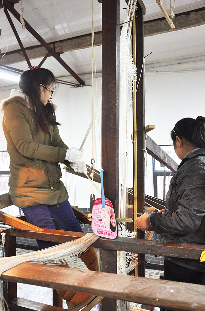 Hands on experience pulling warp threads.