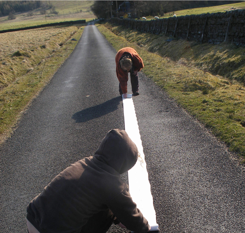 Making of 'on the road' artwork, a graphite line drawn for one mile on paper and mapping everything either side of line.