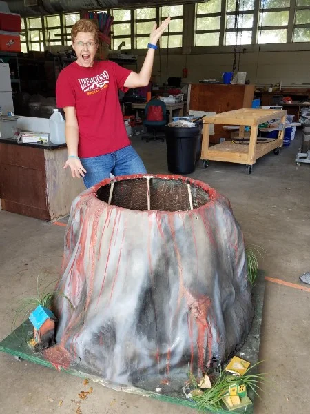 Dr. Mel Rodgers with a model volcano.