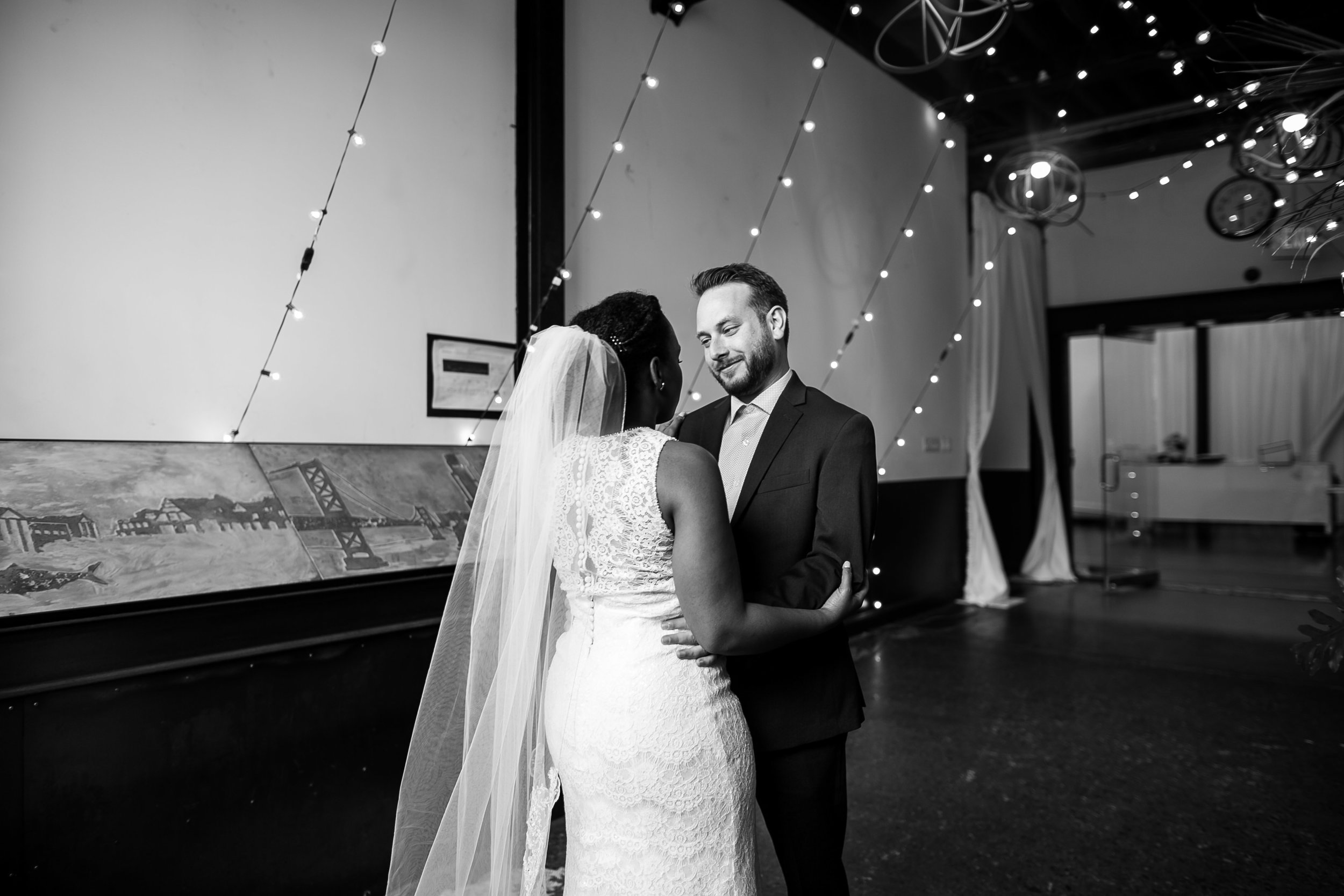 A Philadelphia Fishtown Skybox Wedding by Lesbian Photographer Swiger Photographer. Monet and Daniel - an industrial fall Philly Wedding