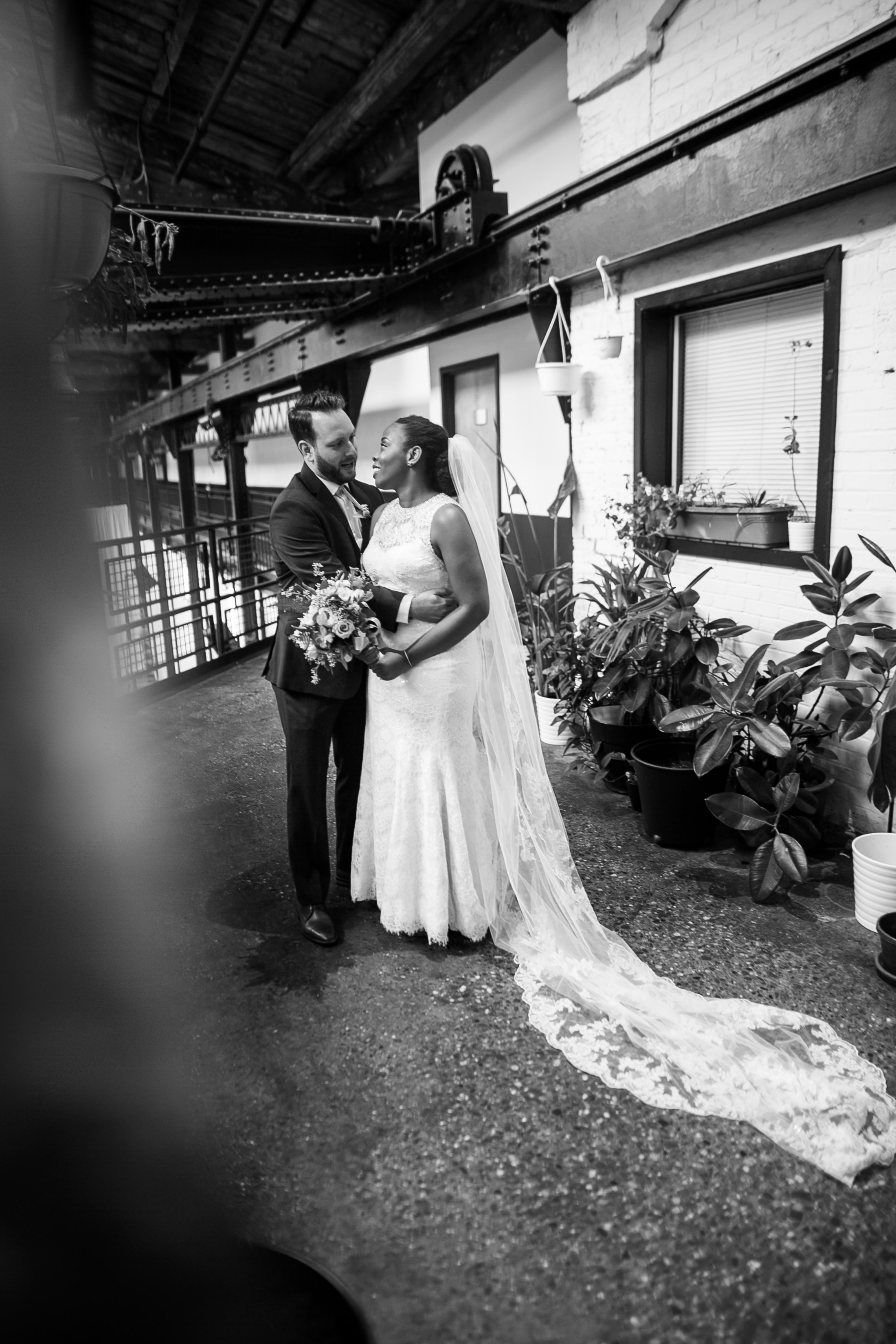 A Philadelphia Fishtown Skybox Wedding by Lesbian Photographer Swiger Photographer. Monet and Daniel - an industrial fall Philly Wedding