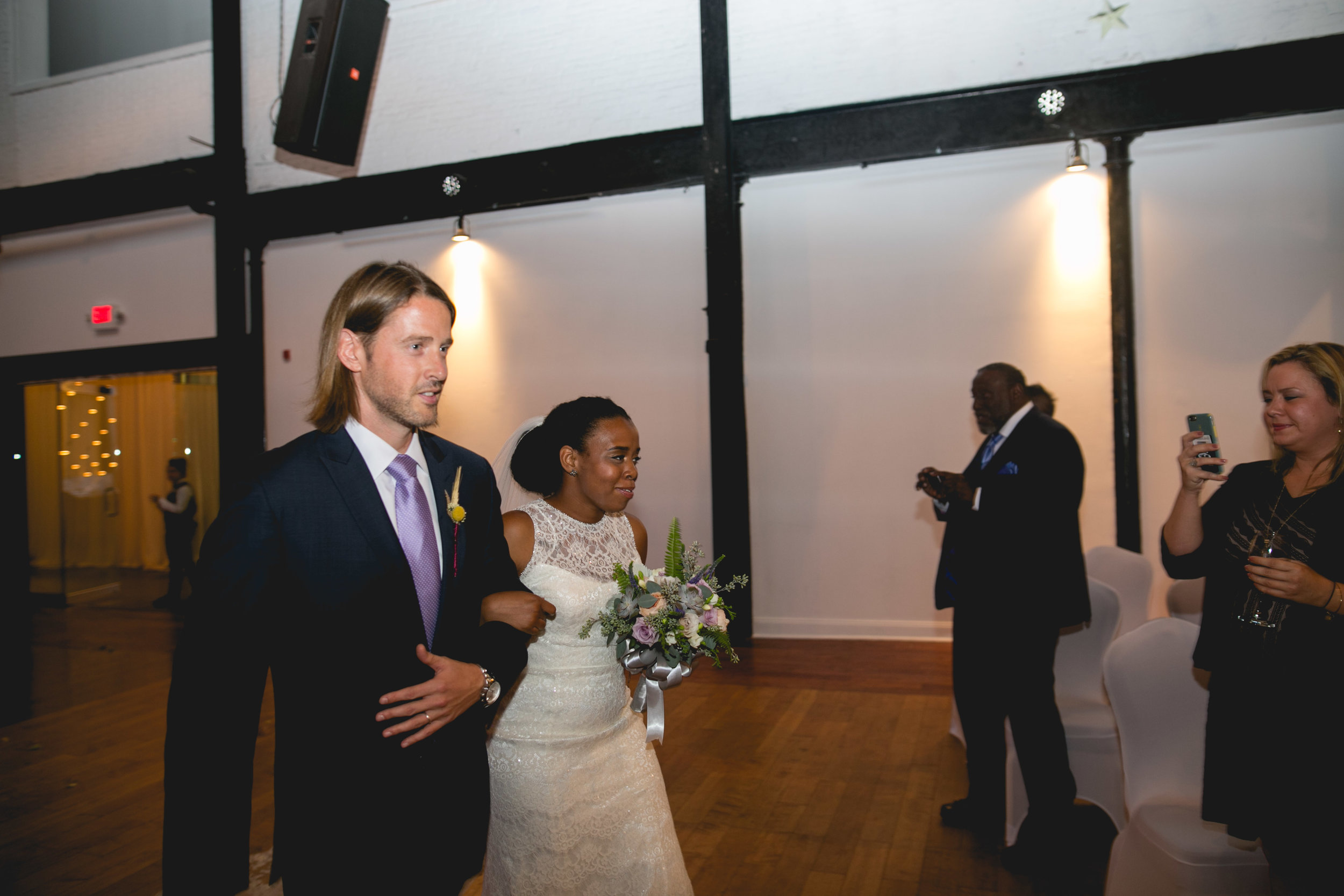 A Philadelphia Fishtown Skybox Wedding by Lesbian Photographer Swiger Photographer. Monet and Daniel - an industrial fall Philly Wedding