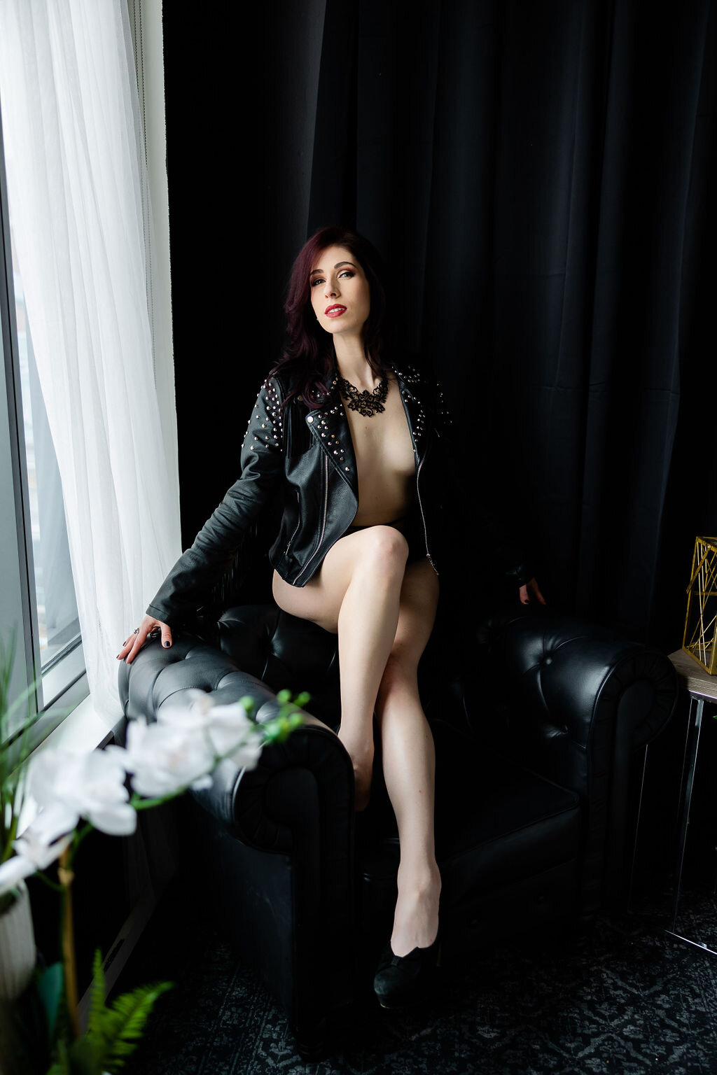 leather-jacket-seated-window-boudoir-pose