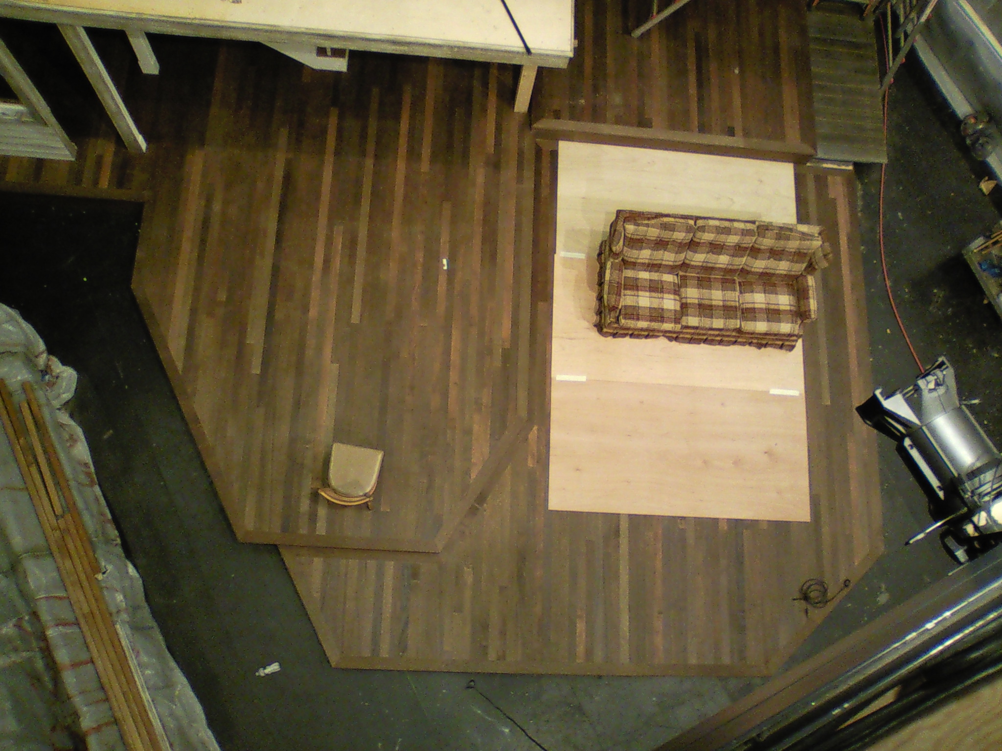  Aerial view of  August: Osage County  flooring made up of ripped sheets of stained lauan, makes for a good facsimile of hardwood flooring. 