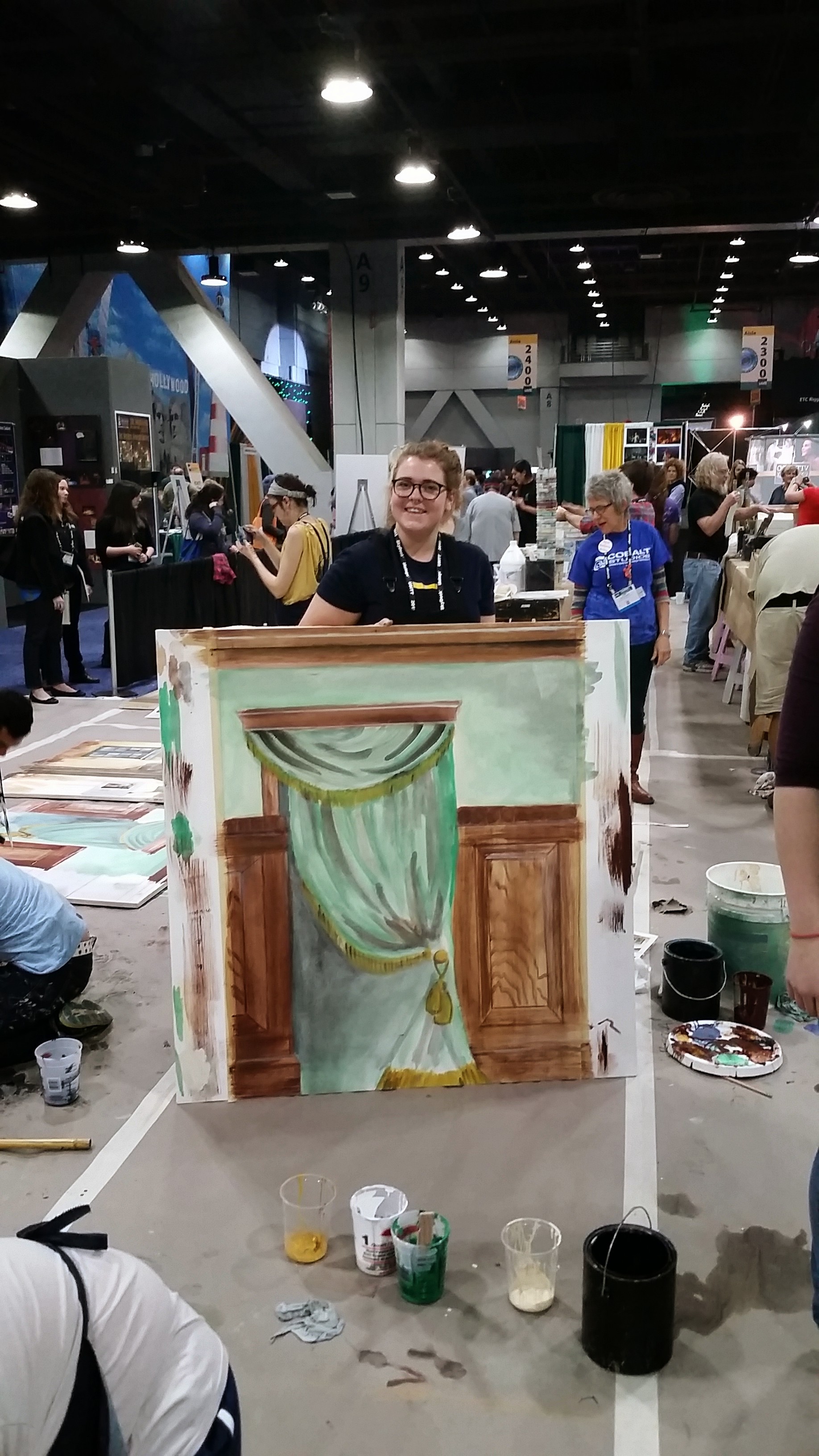  Becca Smith (2016) takes part in the scenic painting workshop at USITT 2015 Cincinnati. 