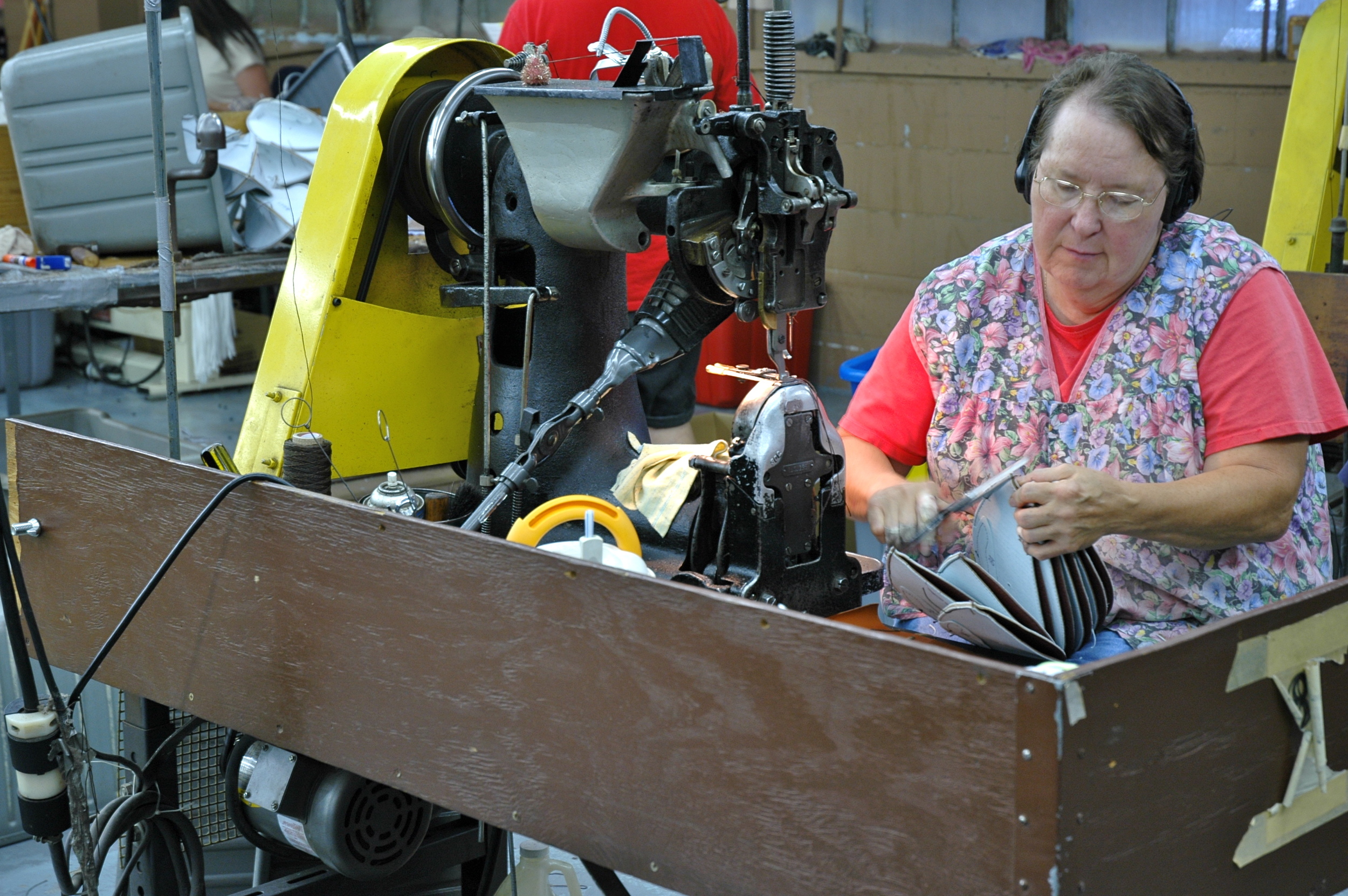 woman assembling footballs