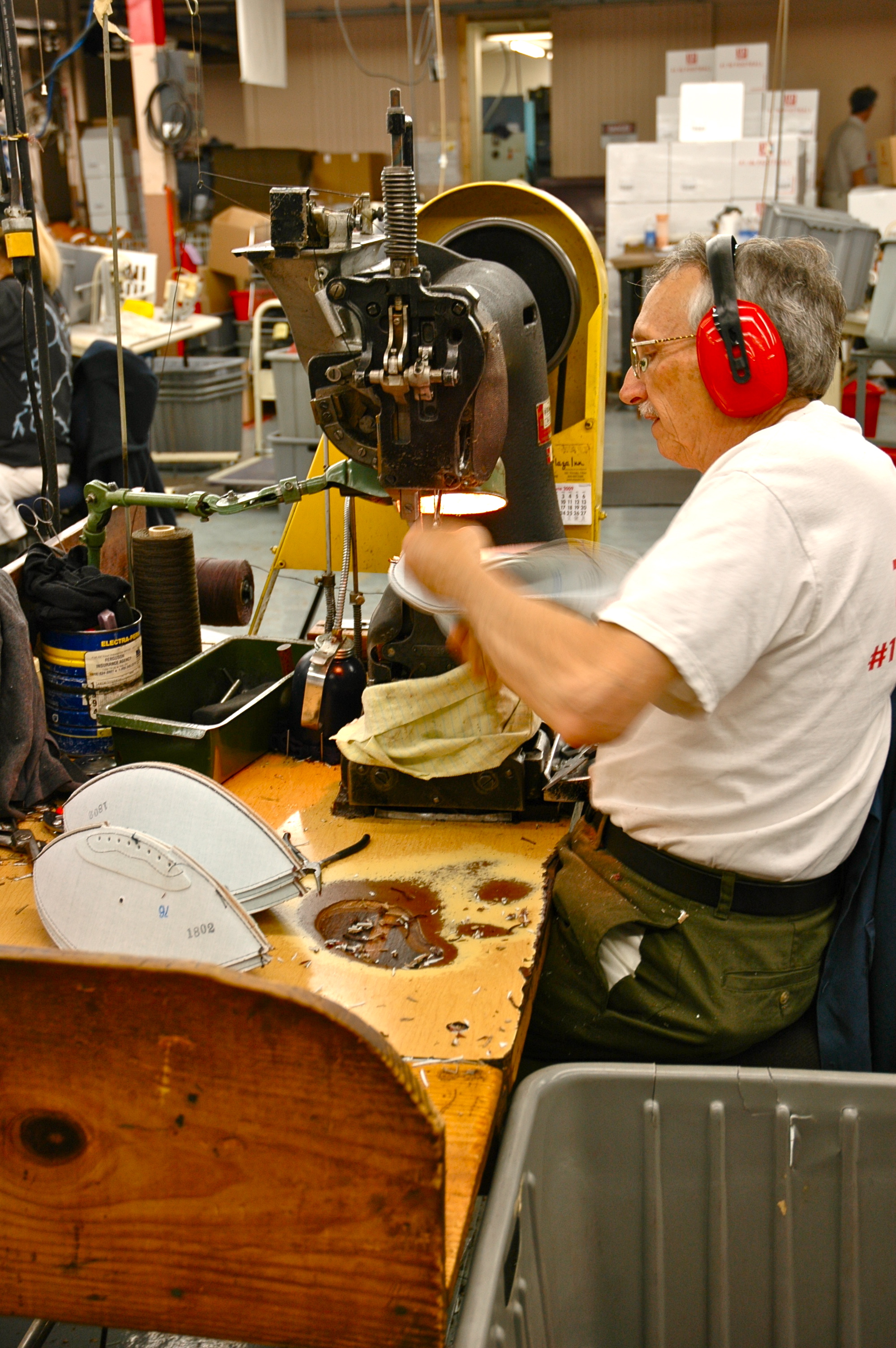 man working with protective ear covering