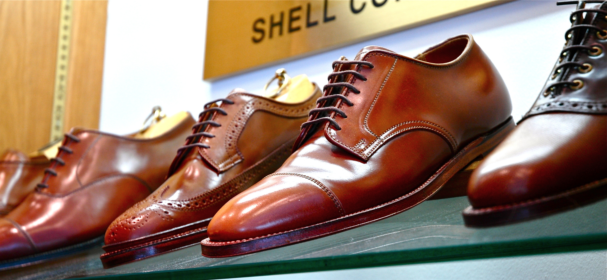 leather shoes on a glass shelf