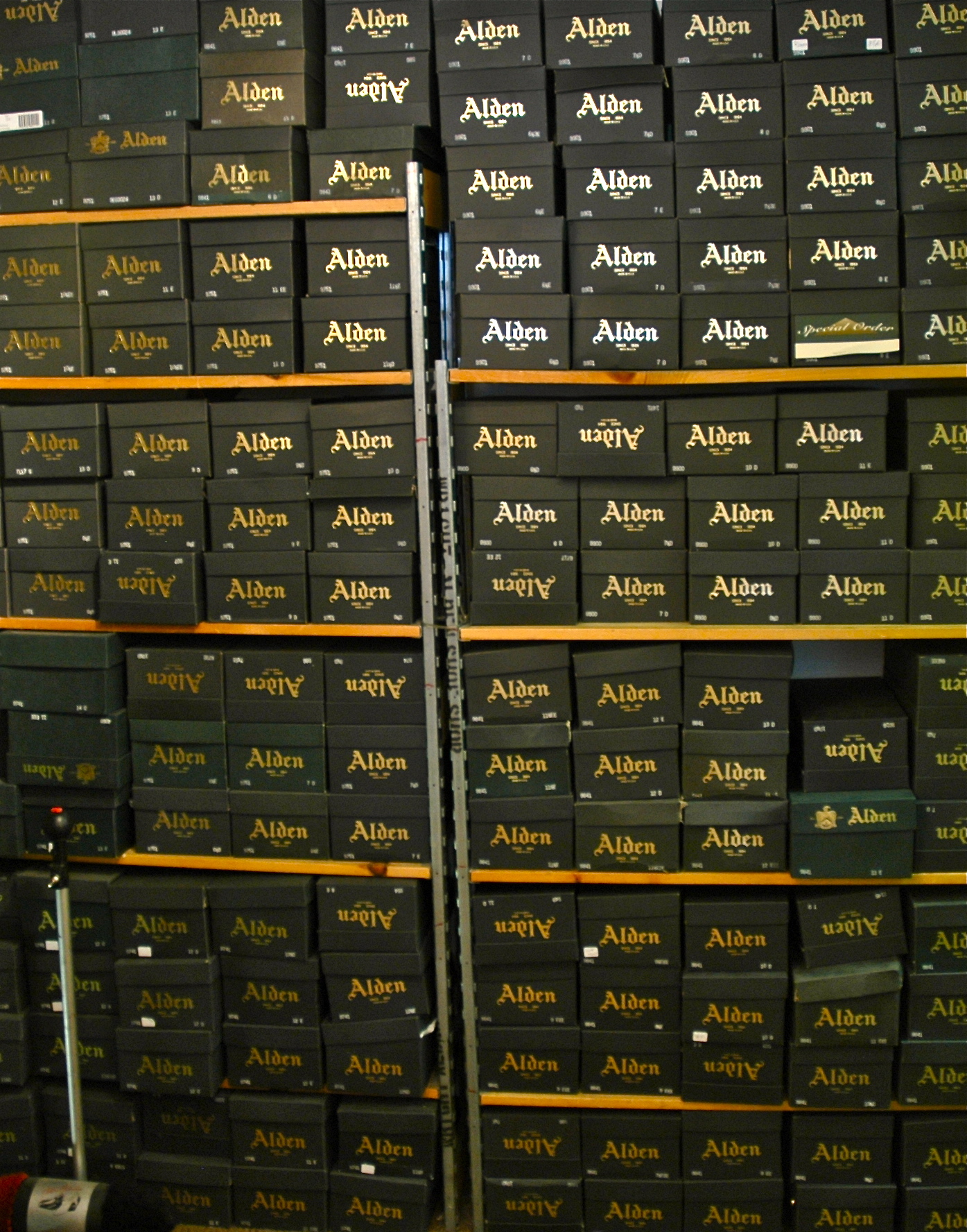 black Alden shoe boxes stacked
