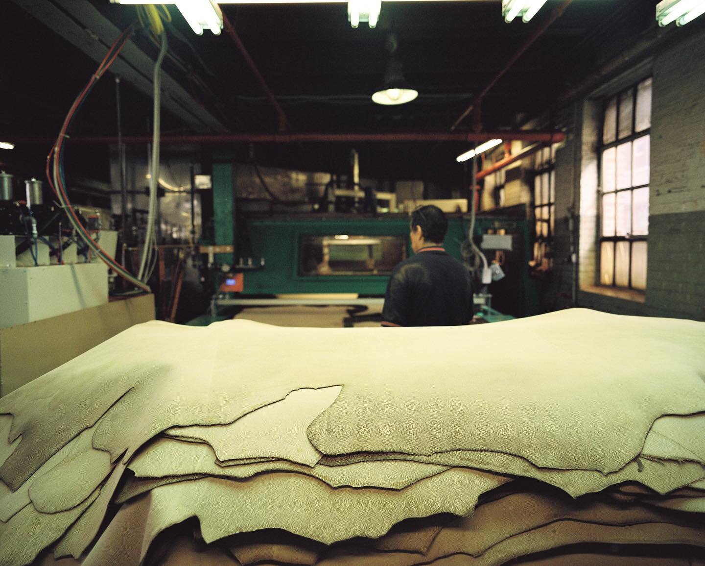 Football leather waiting for color. The embossing process utilizes heat and darkens the leather. We apply dye after the pebble pattern is added in order to successfully color match each order.