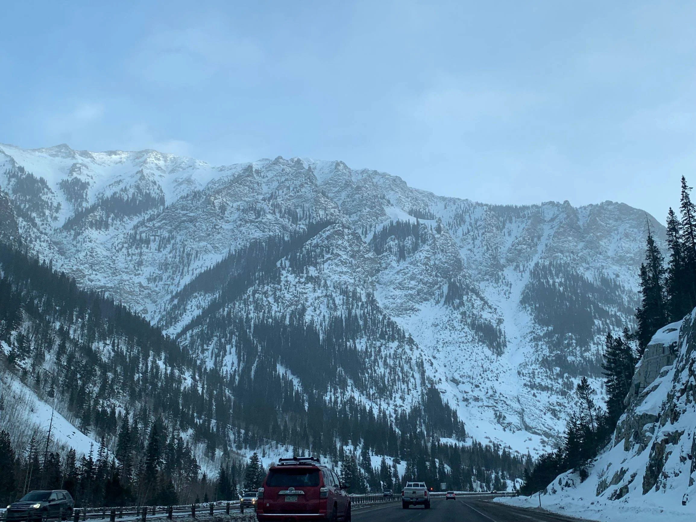 Highway I-70 going through a valley in the Rocky Mountains.