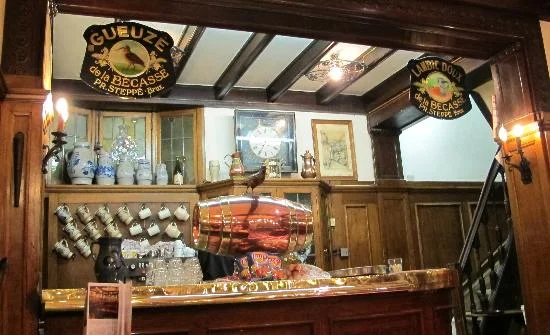 À -LA-B È CASSE https://www.alabecasse.com Small, very old school bar and just off the Grand Place (look out for red neon sign). Get Lambicus Blanche and it comes in a clay jug.