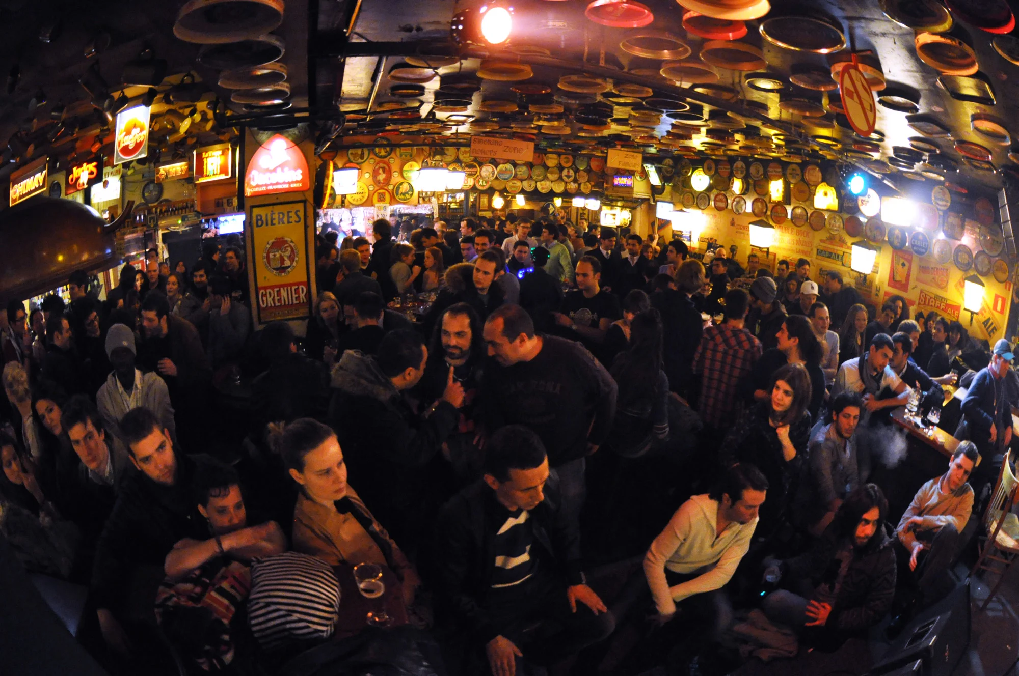 DELIRIUM CAFE http://www.deliriumcafe.be Started as one downstairs cafe with 2000 beers. Now they have a taphouse upstairs and 'hoppy loft' on upper level, as well as a whole street! The alley includes a rum bar (800 rums) and a tequila bar (500 tequilas) and generally ALOT of fun. Always busy, no matter what night you go, full of folk travelling and looking for a big night without hitting da club. Much more chilled during the day. Also features Jeanechin Pis, the female version of famous statue. Just a small alley and easily missed. 