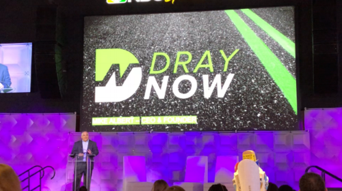 On the main stage at Xfinity Live, Mike Albert presents at the PACT Capital Conference.