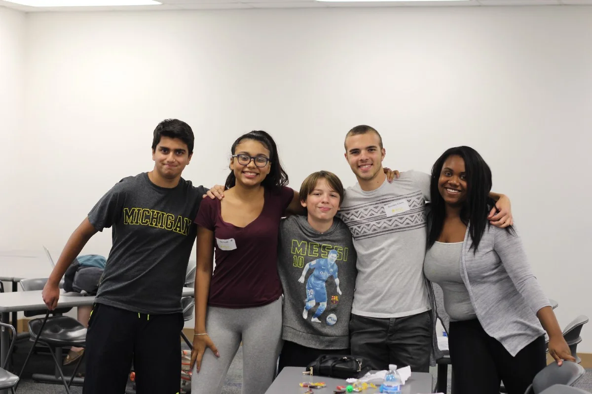 One of our facilitators, Brendan, with his team of high school students.