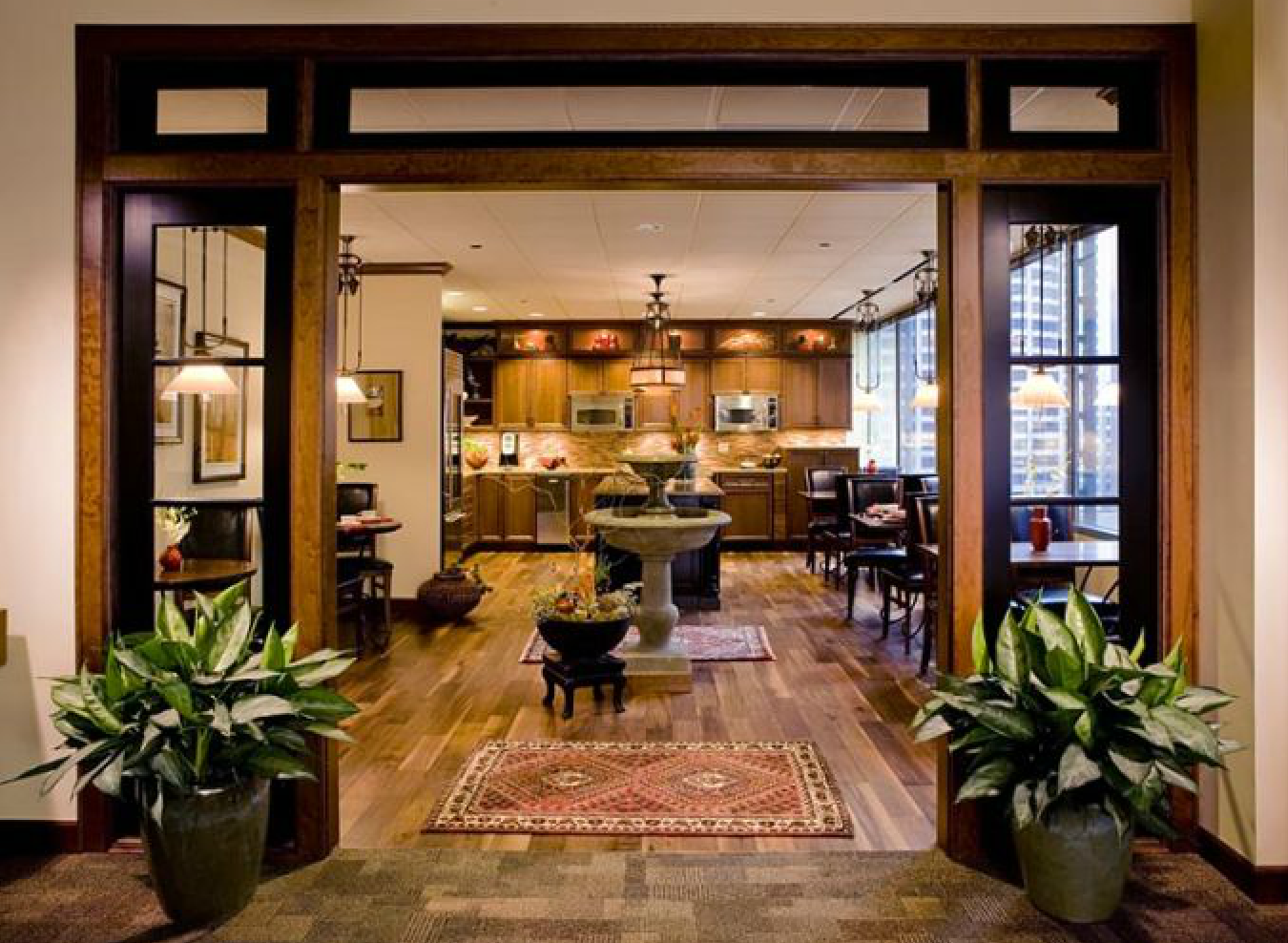 Antiques, warm woods, Asian accents and fine art reflect the finer tastes of the Chicago firm’s owner.