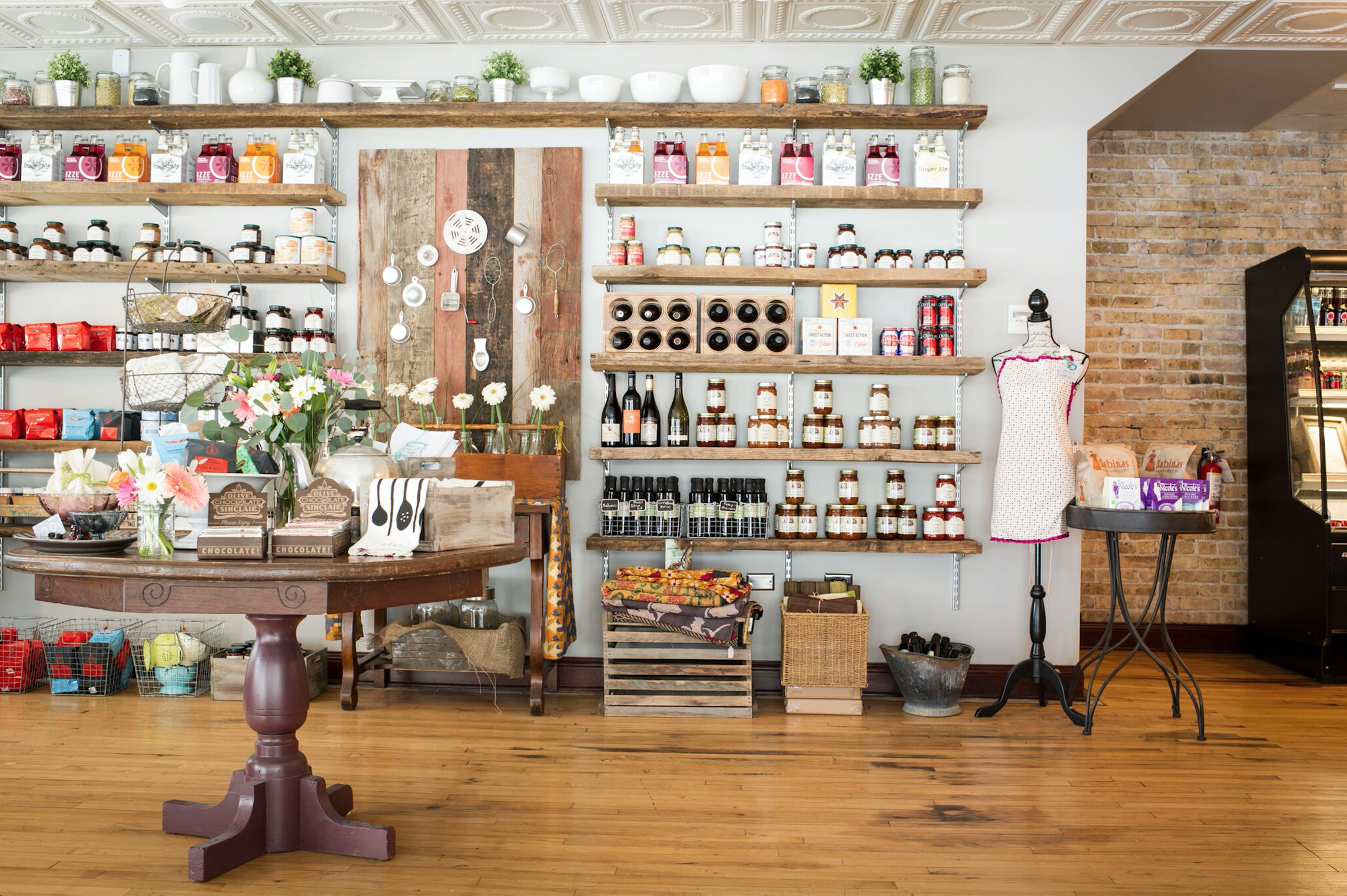 Vintage shelves and table with barn wood welcome market guests at this Glen Ellyn restaurant.