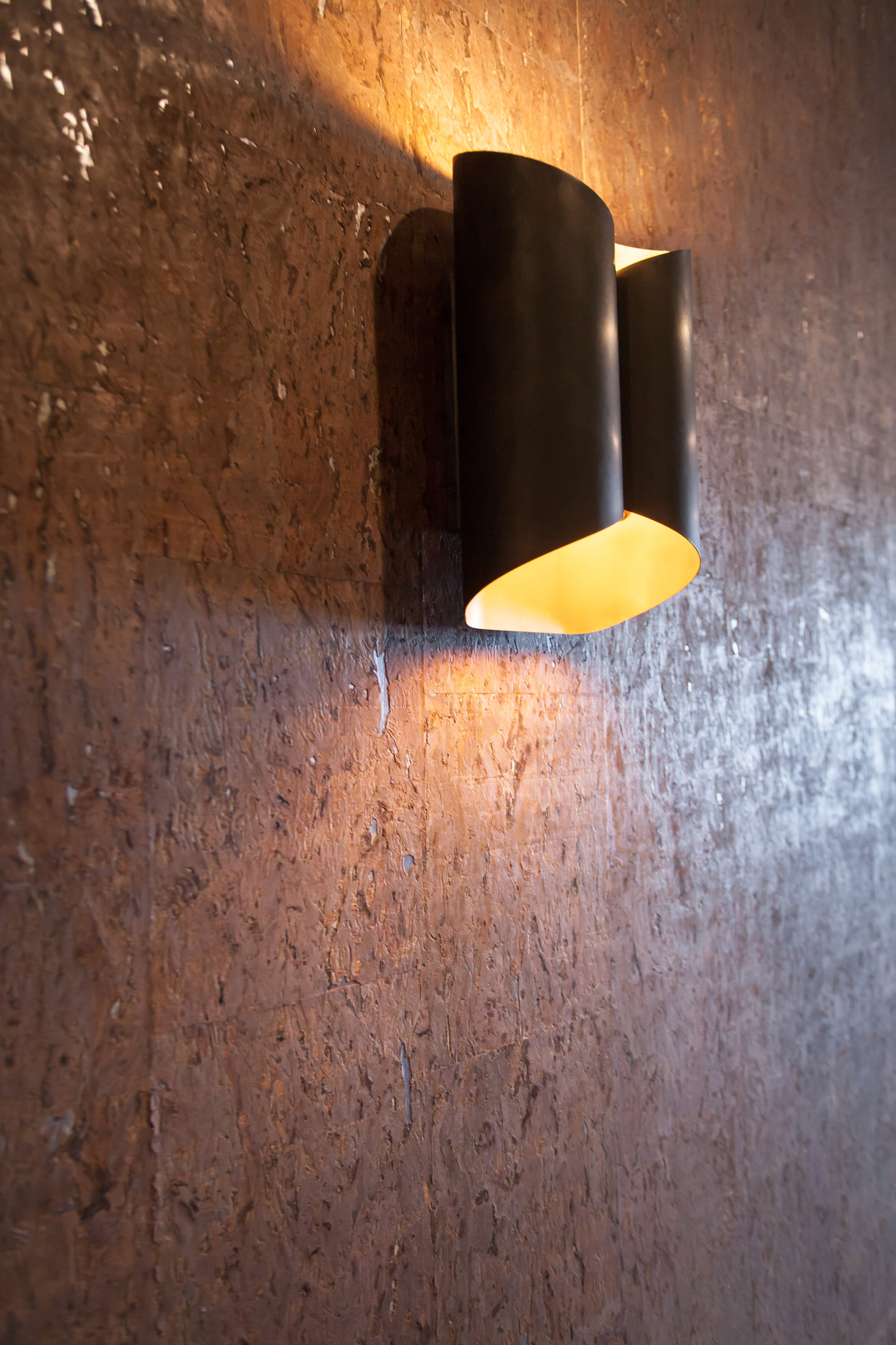 Wall sconce for midcentury modern office design in Wheaton by Two Hands Interiors.
