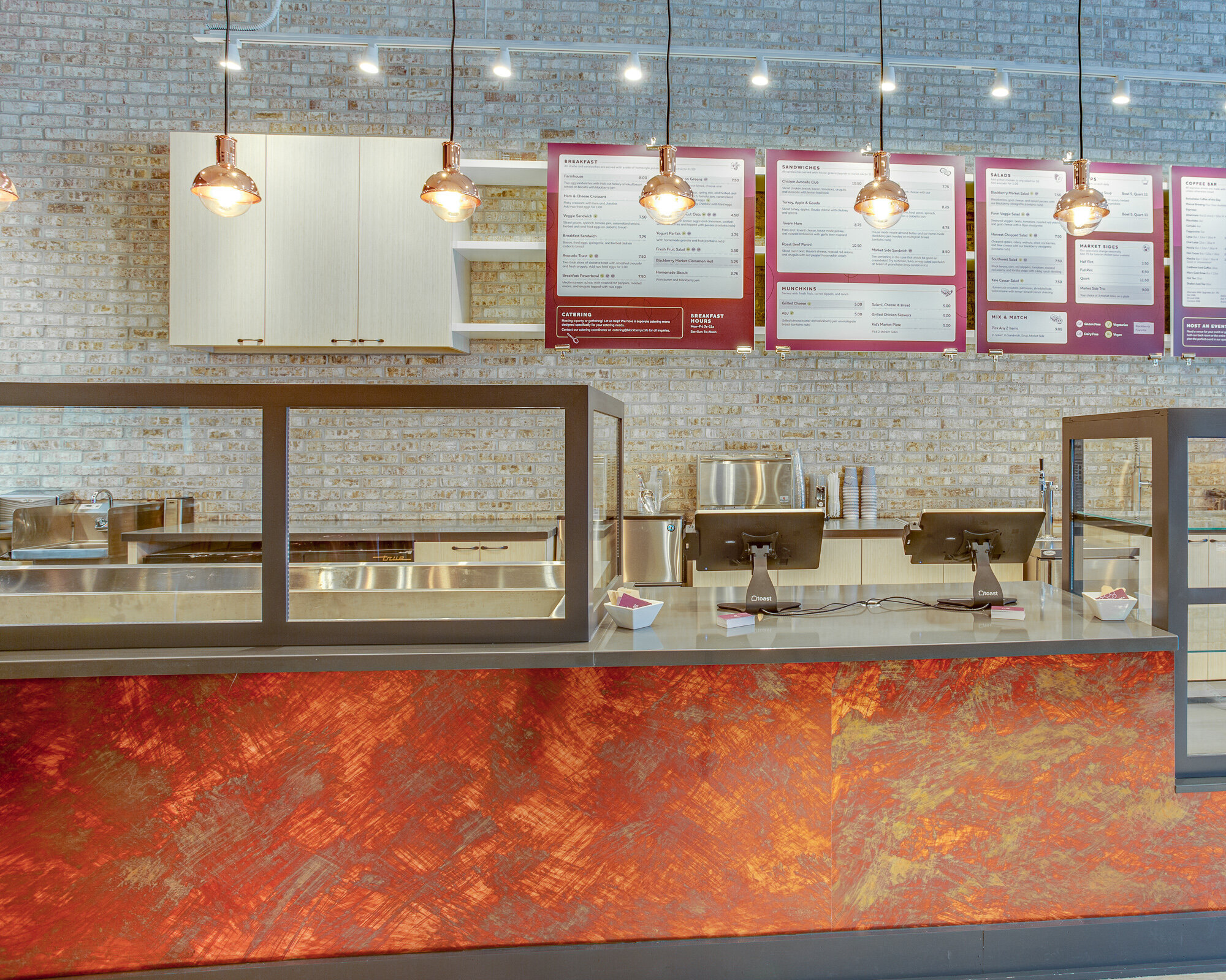 A fresh bakery design with Mitzi lights, copper cladding, and unique menu boards in La Grange 