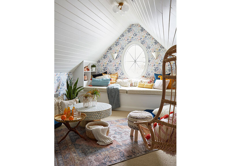 A teen hangout destination with a comfortable boho vibe. Brought together by Anthropologie Rose Petals Wallpaper, Serena and Lilly hanging chair, Cristol flush mount by Circa Lighting.