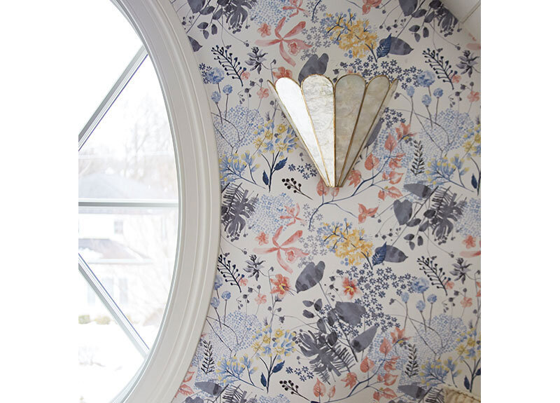 Feminine and playful Anthropologie Rose Petals Wallpaper with the pretty Madelyn Faceted sconce add a softness to this teen attic hangout space. Design by Two Hands Interiors.