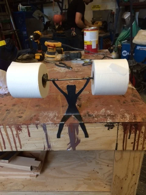 Olympic lifting toilet roll holder