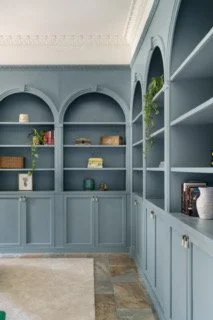 Arched built in cabinets with hidden door