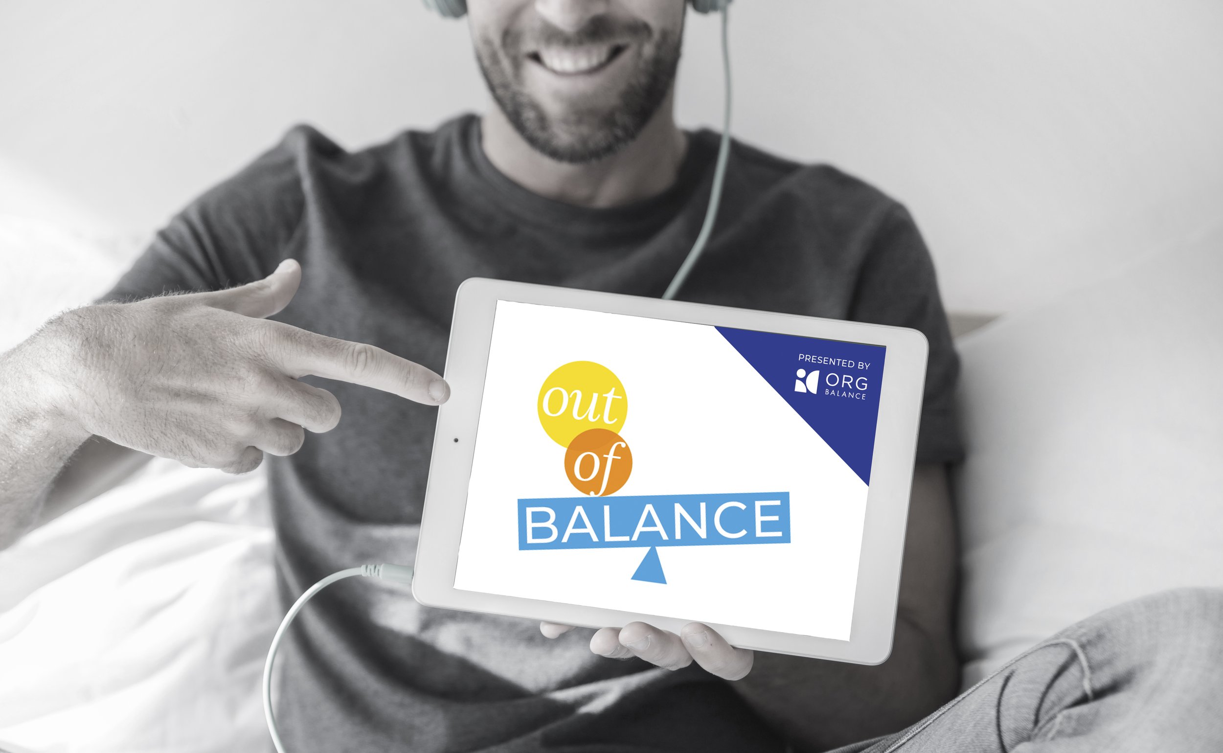 young-man-holding-tablet-with-ord balance podcast.jpg