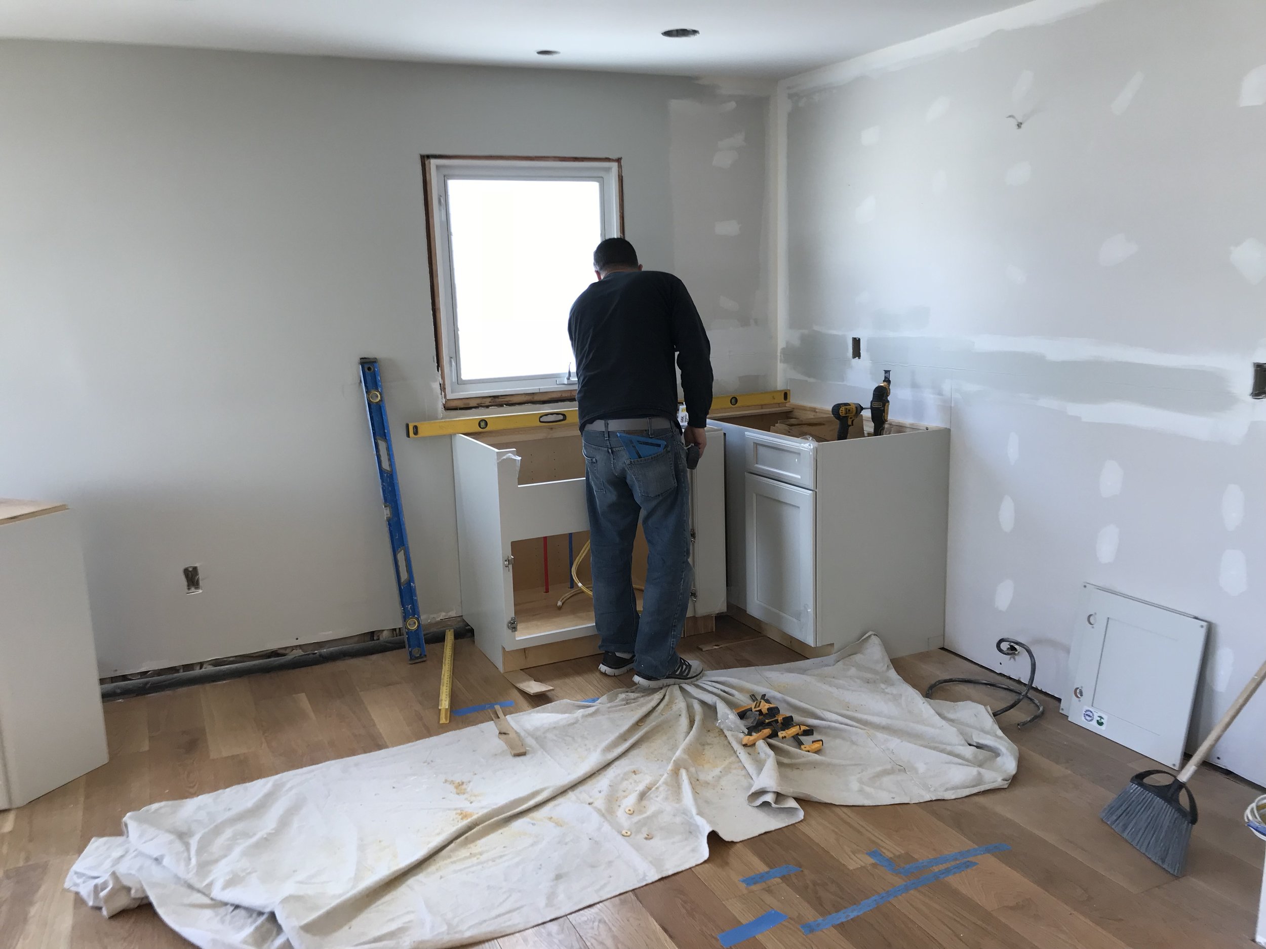  This first floor remodel includes kitchen, living room, and bathroom renovations. The overall project includes demo, framing, installing new insulation, drywall, priming/painting, installing new floors and doors, brand new cabinets and countertops, 