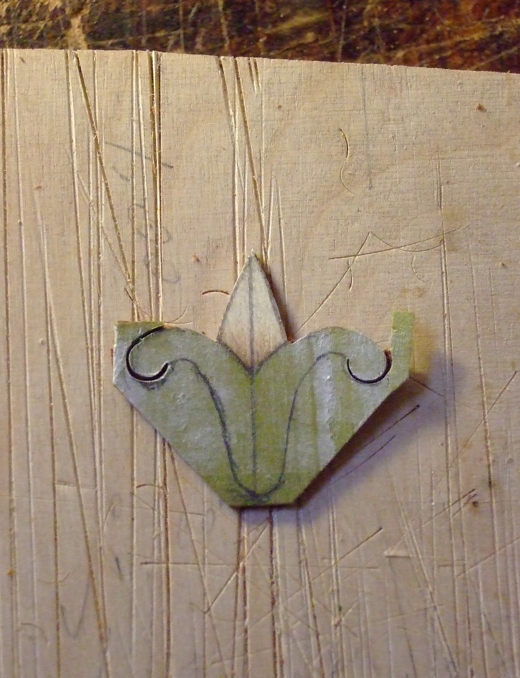 The largest of the bellflowers being cut to shape in preparation for inlay into sycamore fan. The tip is sand shaded holly.