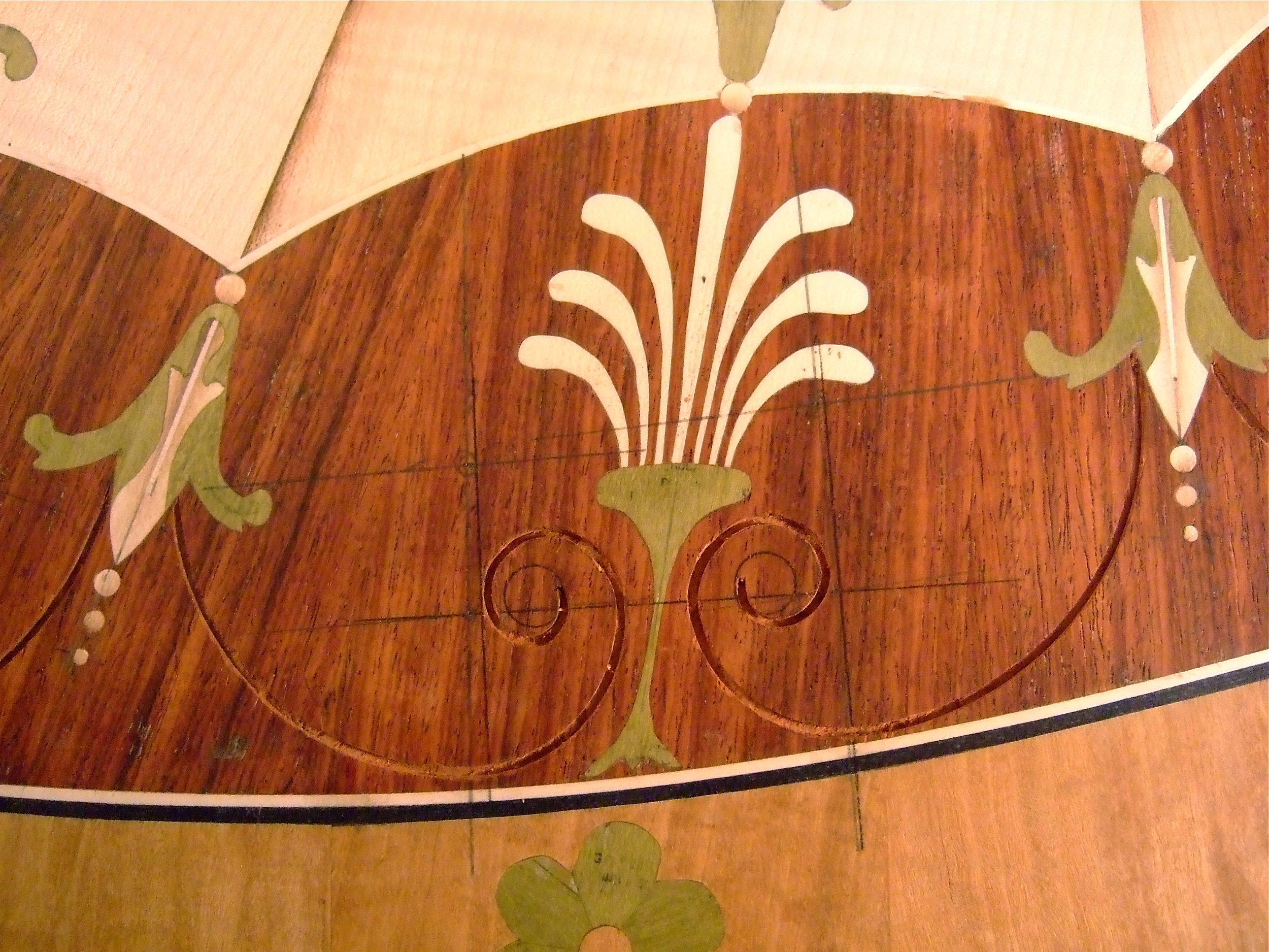 Cutting the negative spaces for inlaying the volutes.