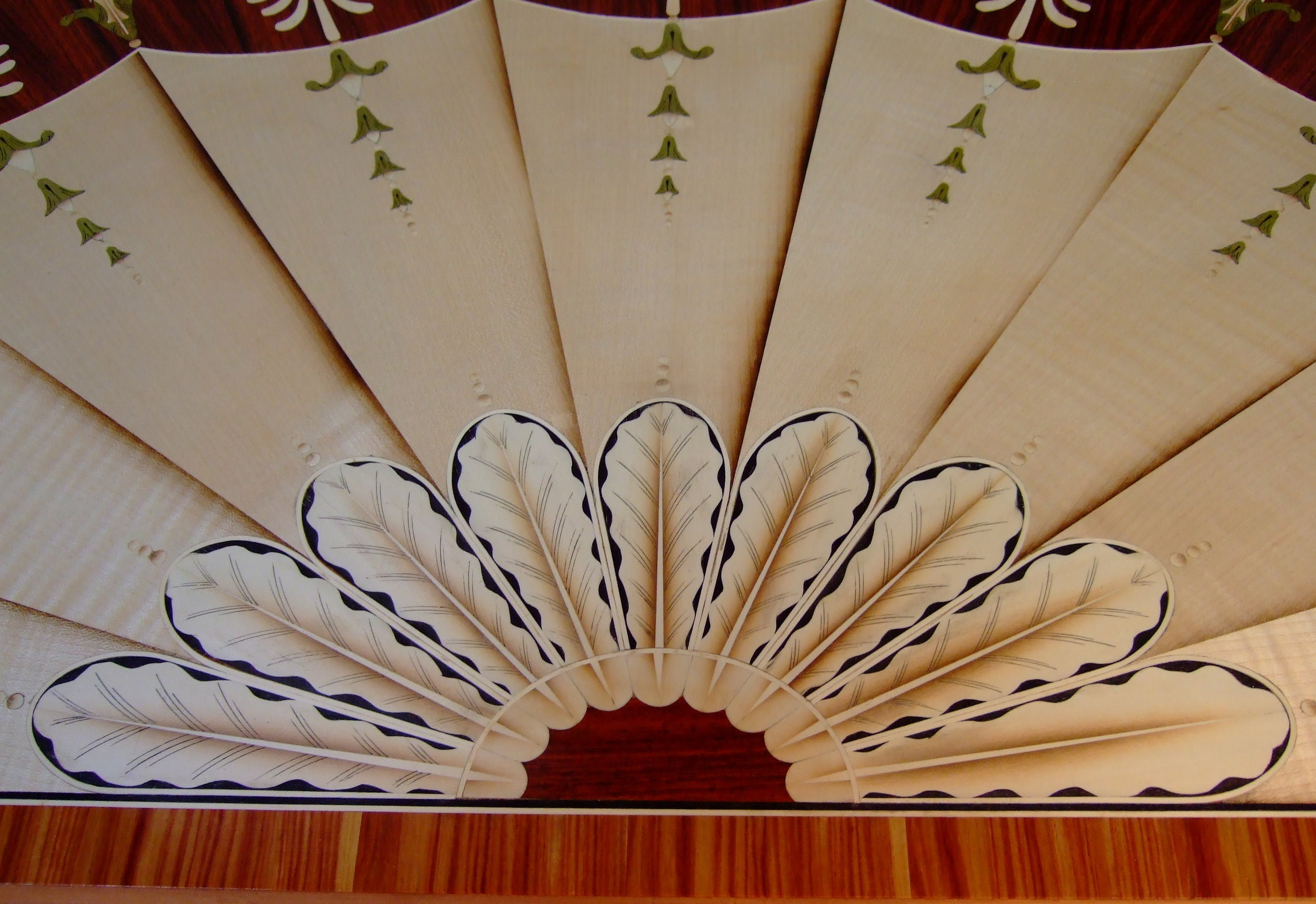 Engraving feather details, note the far right feather has yet to be engraved.