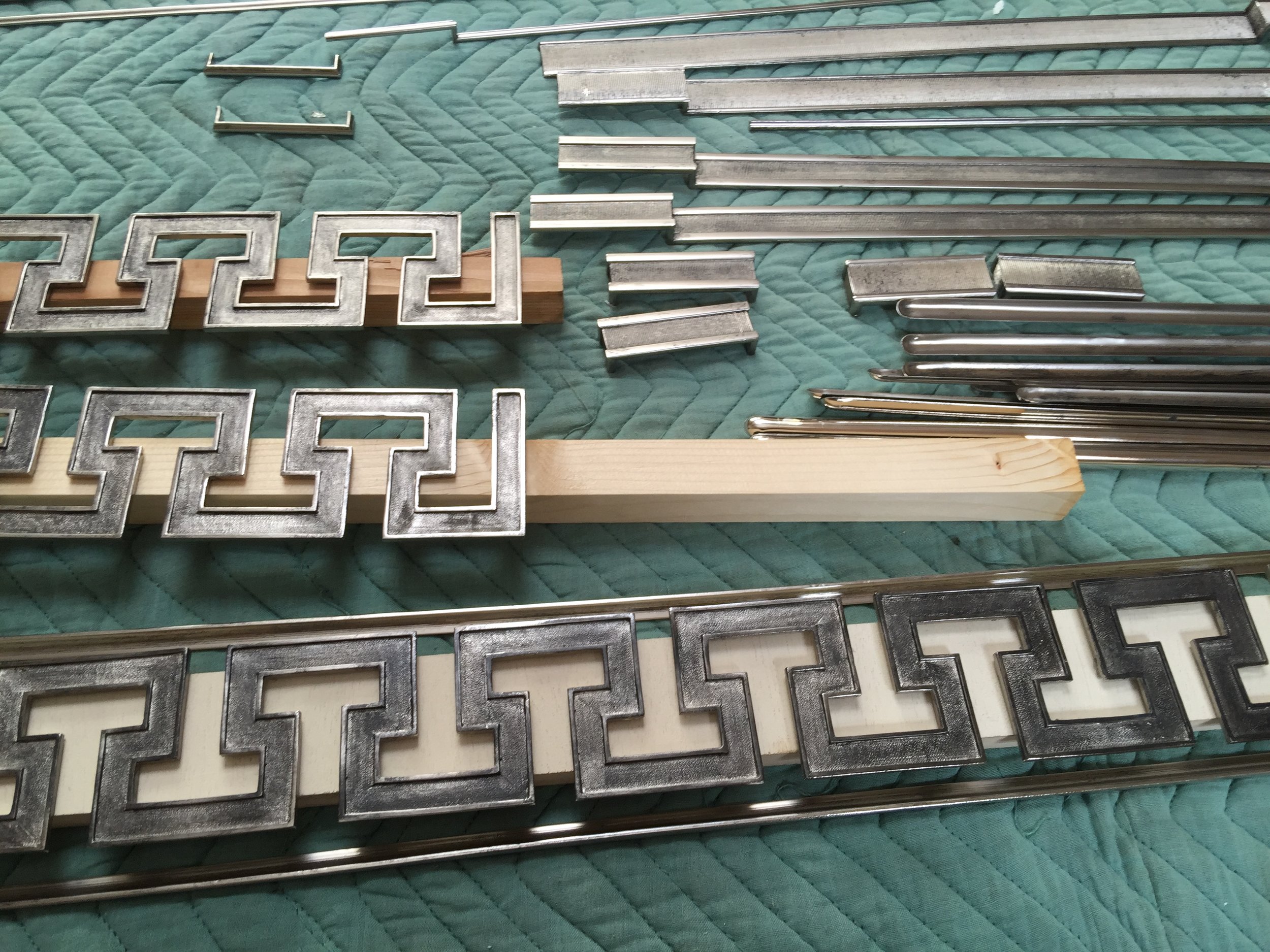 Assortment of nickel plated bronze Greek key, belts and moldings from Paris.