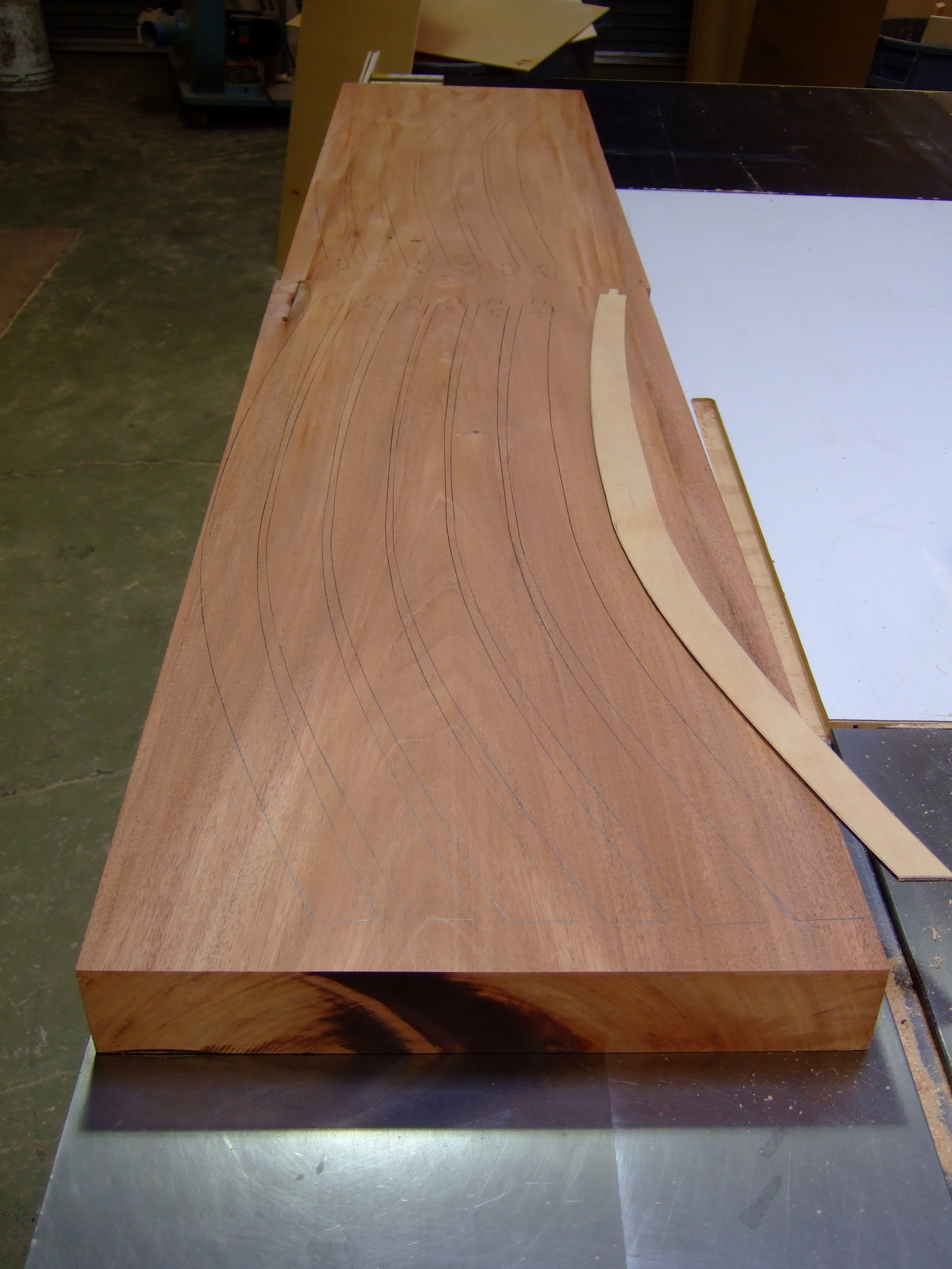 I'm nesting the rear posts for the chairs out of a single 8/4 piece of genuine mahogany. The plywood template was made from my drawings.