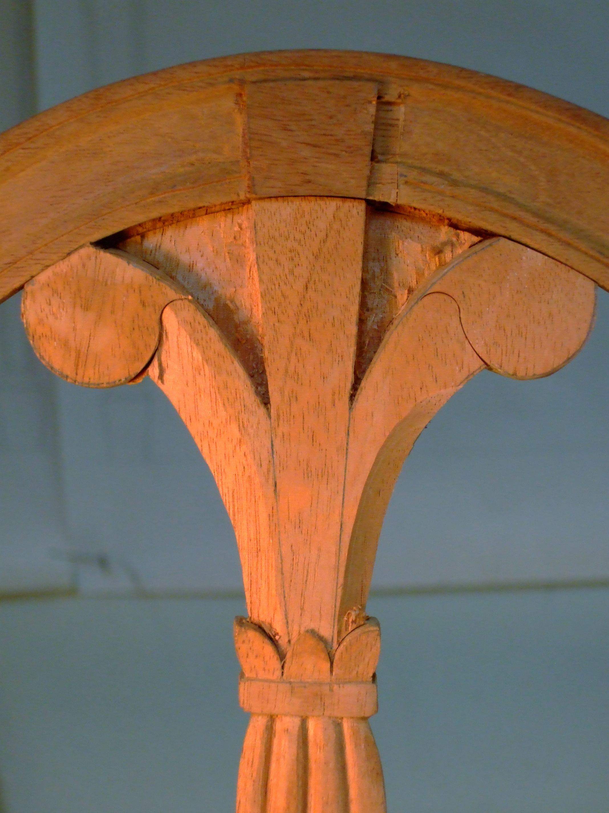A process shot of carving the Prince of Wales plume. I have cut the recessed field on the crestrail and carved the reeded area on the center element. I left some wood to provide strength while carving the plume.