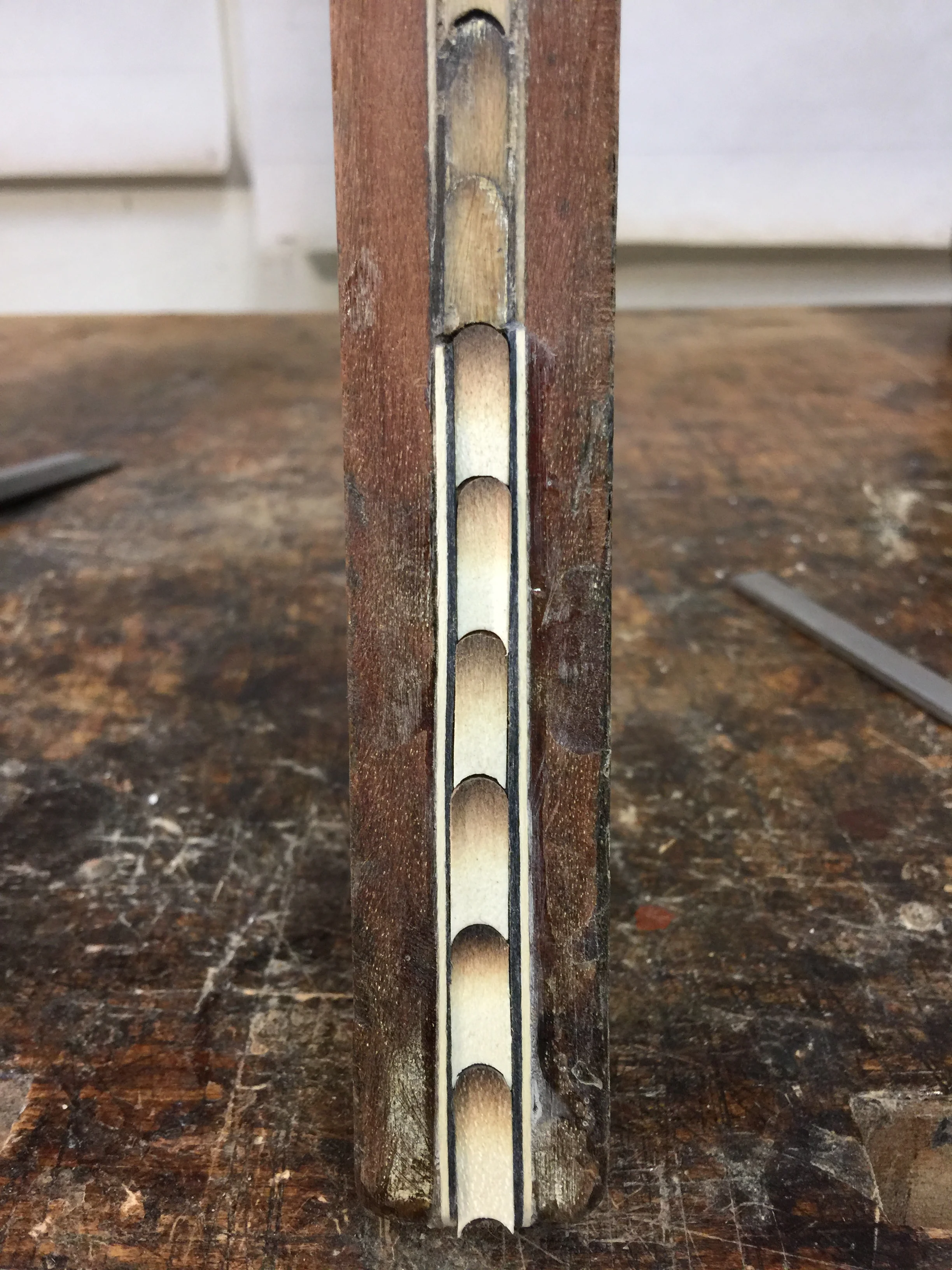 Patching the back of a leg at floor level.