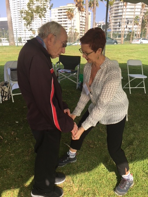 Constance Clare-Newman gives a tune up to a PlwPD at the Parkinson's Foundation Moving Day® Los Angeles in October 2017