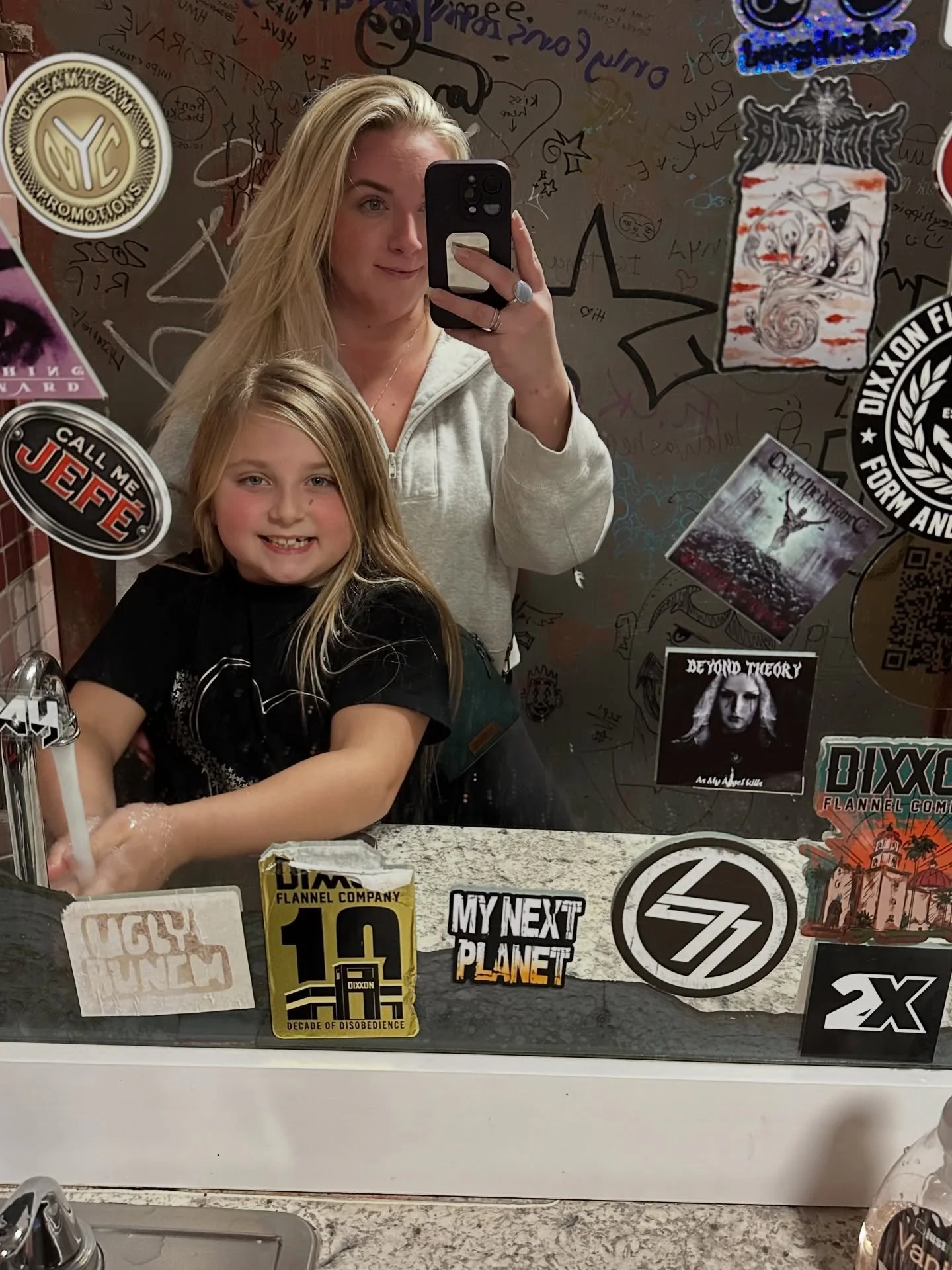 Never thought I&rsquo;d take a bar bathroom selfie with my 8 year old&mdash; but here we are 🤣🥰. So proud of these girls! They got to perform at @tonyvsgarage tonight and absolutely crushed it! Thank you @varsityrockmusicschool 🤍✨🙌🏼