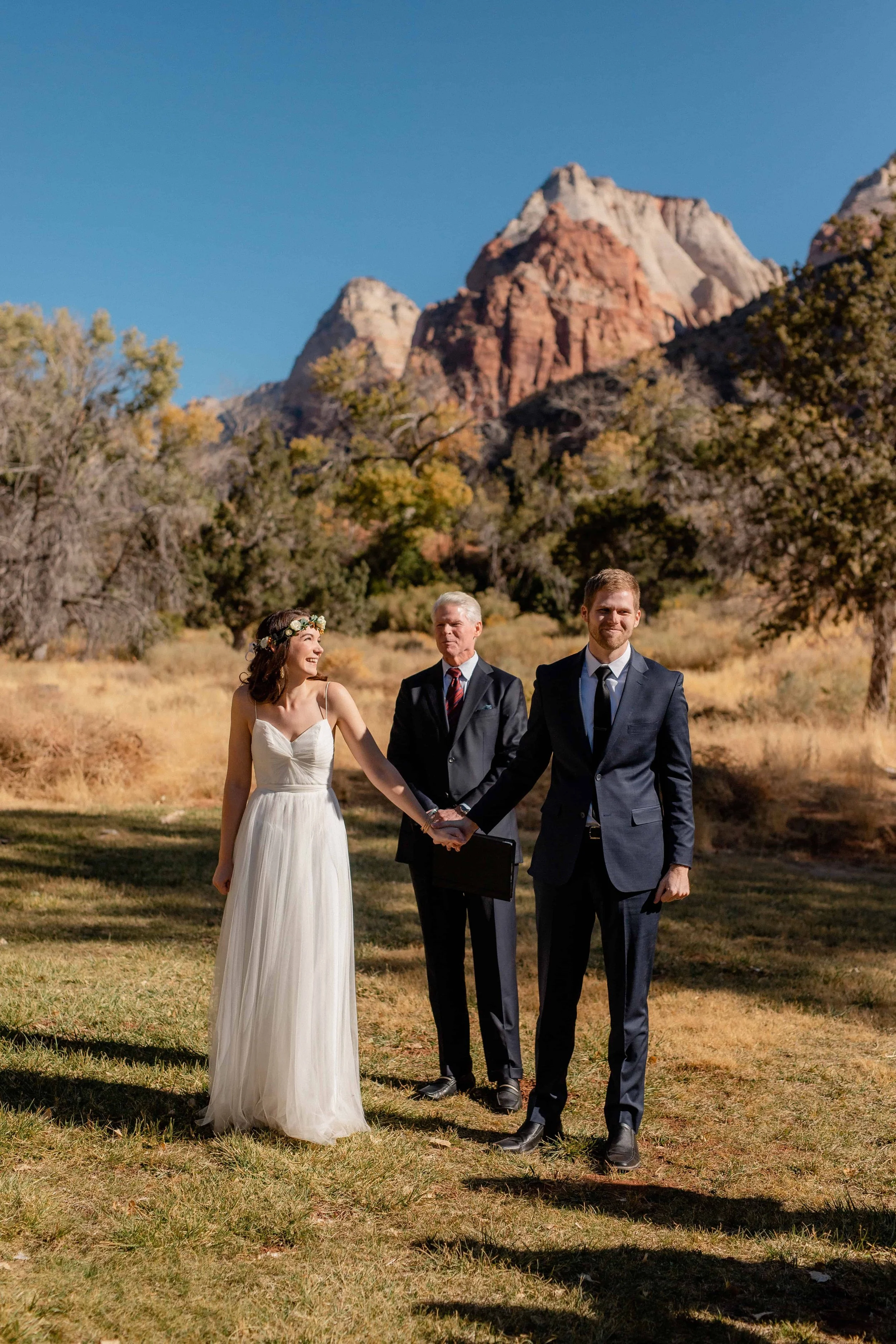 Bride and groom smile during nature center north lawn ceremony