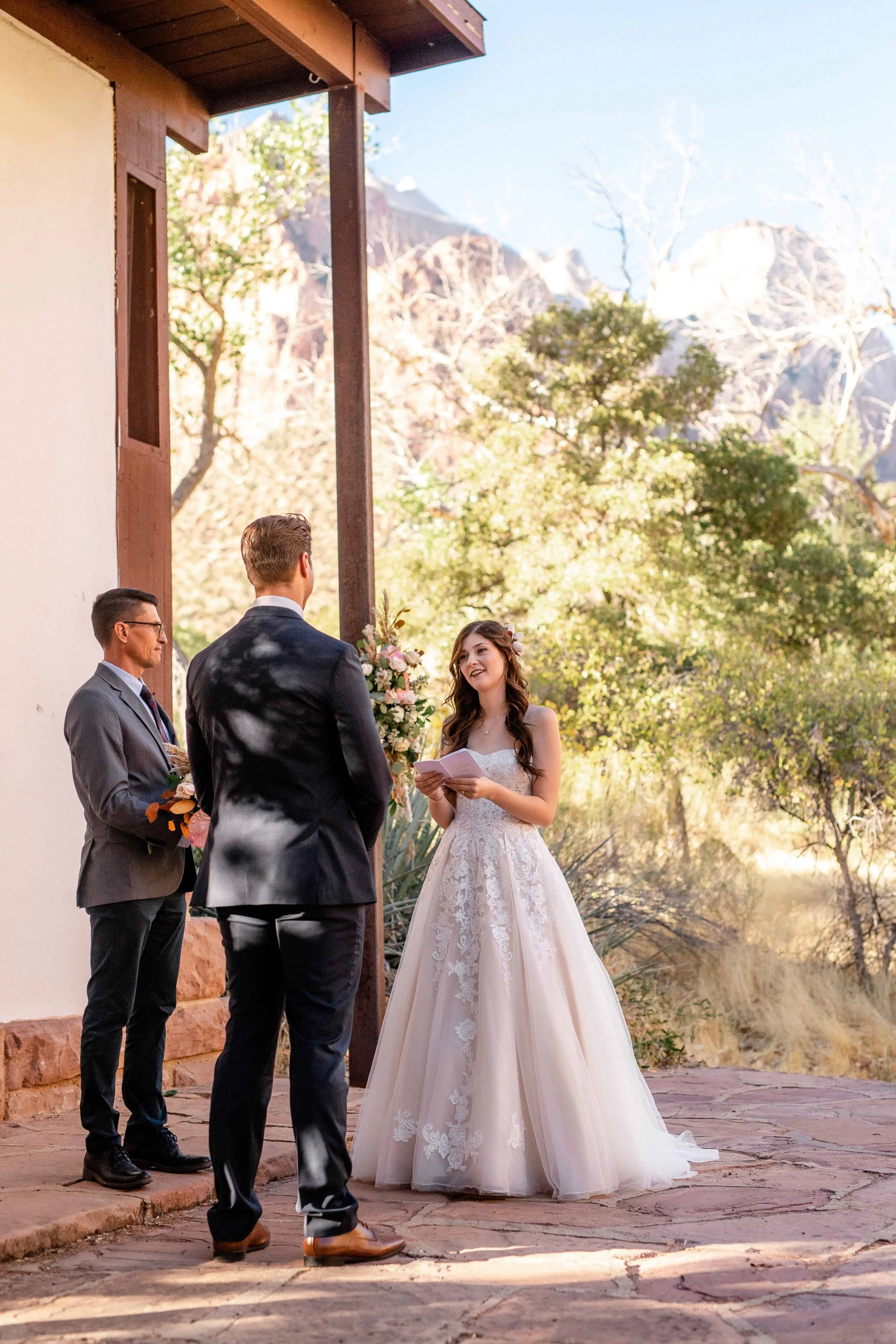 Bride reads vow during south campground amphitheater wedding ceremony