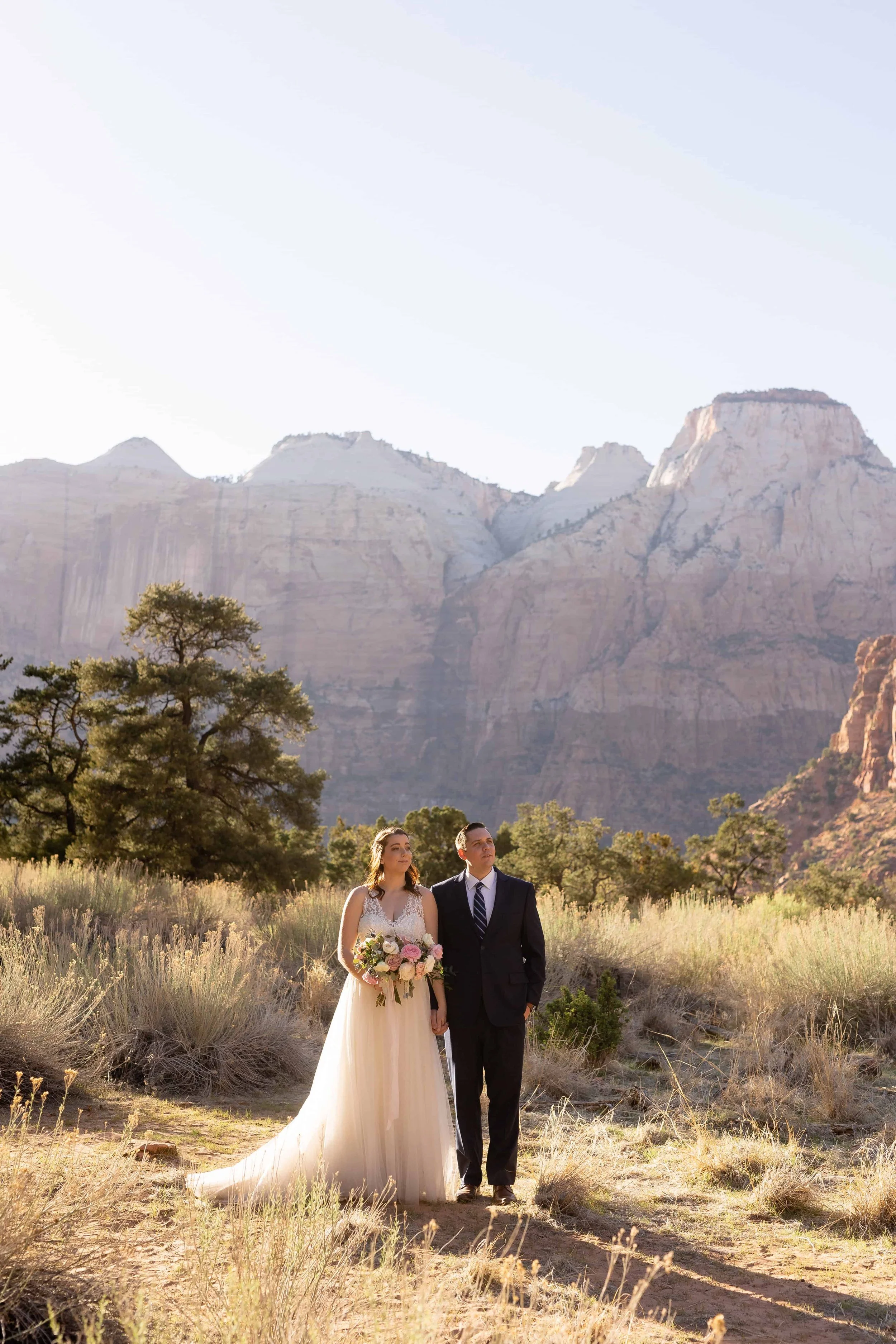 bride and groom pose for portraits after north lawn ceremony in zion