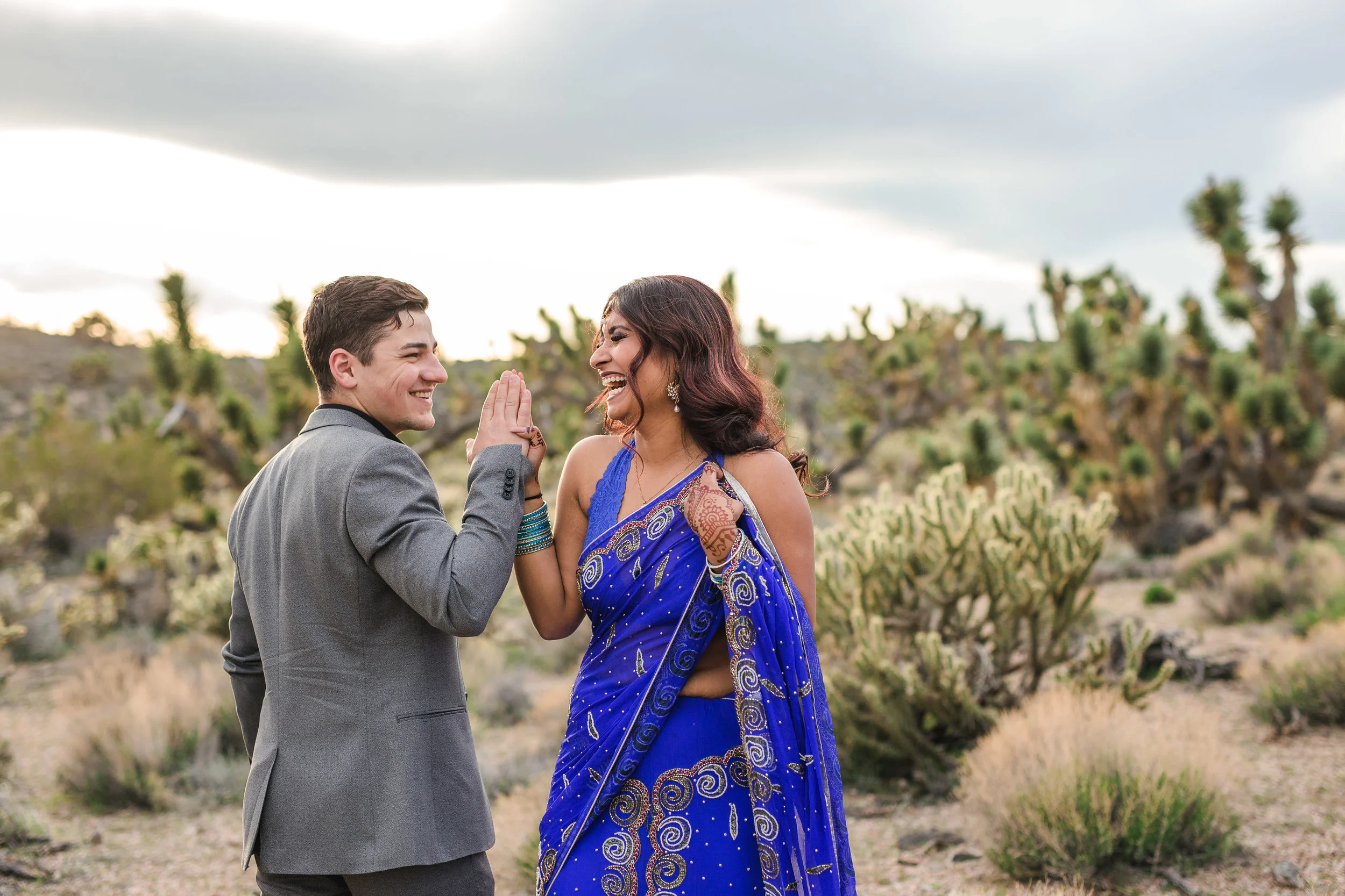 Happy indian bride dancing in the desert Kyle and Tori Sheppard wedding photographers