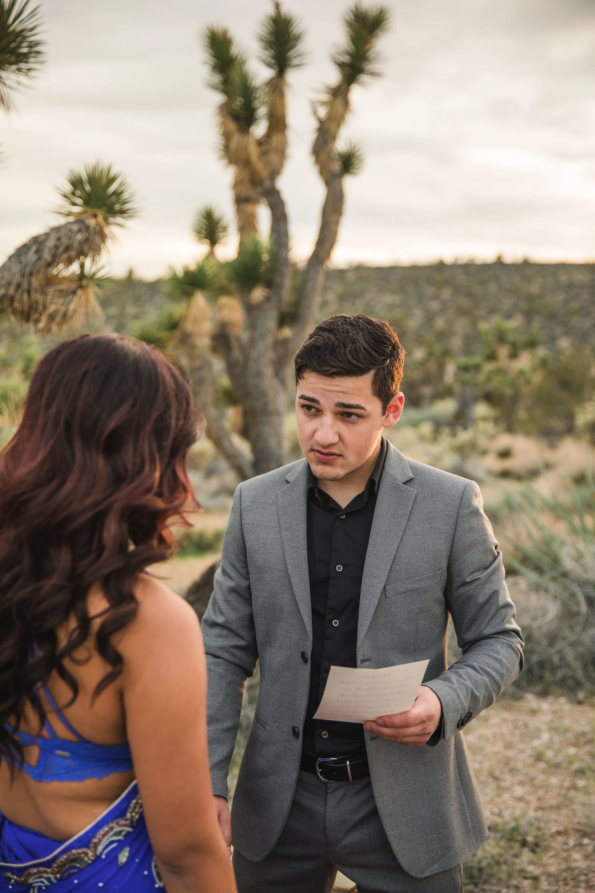 Russian groom in gray Men's Warehouse suit exchanges vows with his bride Kyle Loves Tori Photography