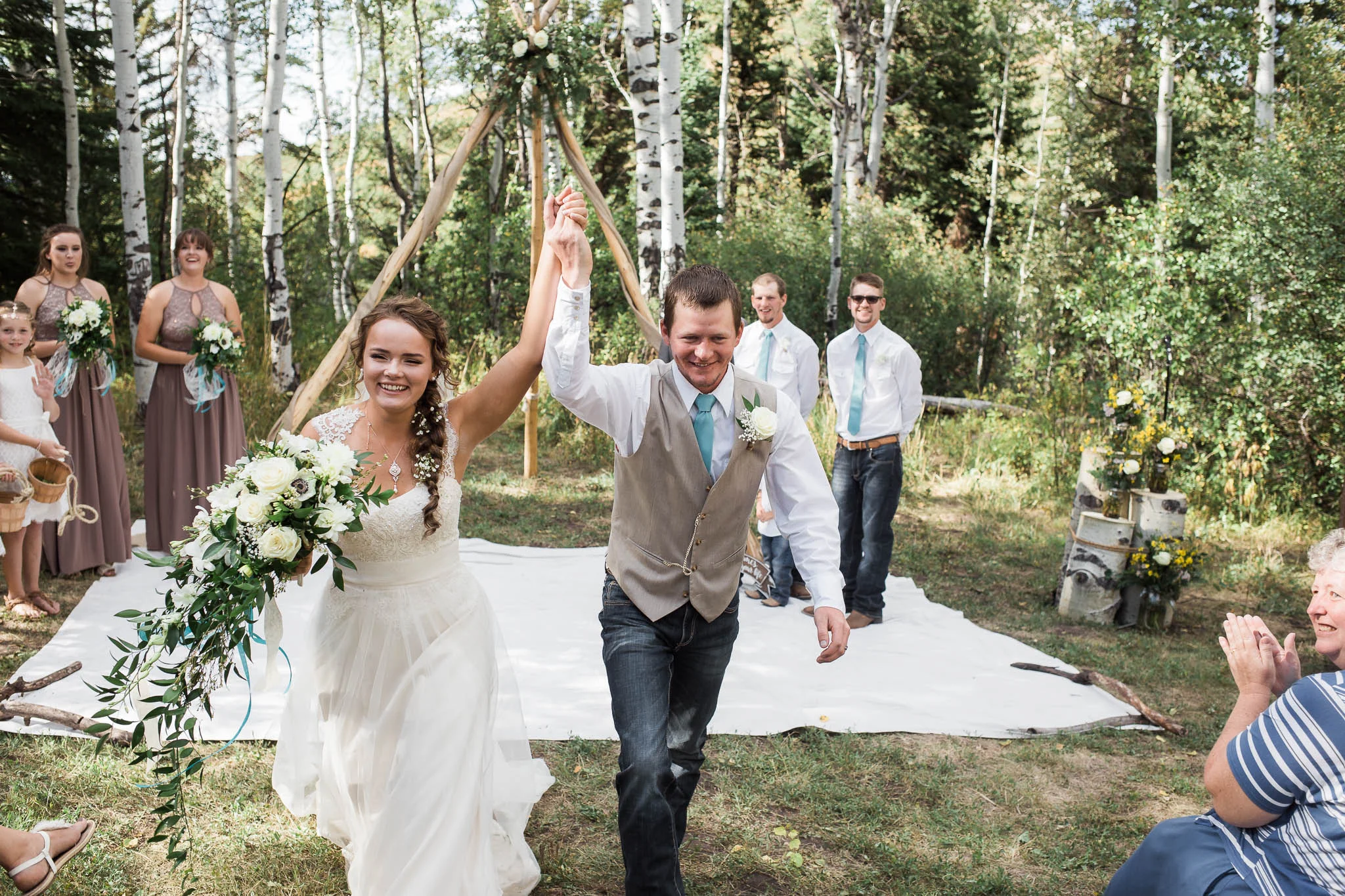 Bride and Groom leave wedding ceremony excitedly